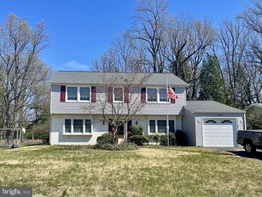Multiple offer situation. Welcome home to this 2,232 square foot Levitt colonial in the sought after Tulip Grove neighborhood within the City of Bowie. The entire upper level plus the living room and kitchen, all have hardwood floors. You will greet your guests in the formal entry with a coat closet and a convenient powder room. There is a wonderful entertainment flow as you pass the formal living and dining rooms. The kitchen is steps away and is adjacent to the freshly painted 20' x 20' family room with a gas fireplace. The rear entertaining space continues the great flow, and Fall is the perfect time to dine alfresco, roast marshmallows around your firepit, or just watch the stars. Wander your way to the upper level and your own private primary bedroom with dual closets and an ensuite bathroom with a standalone shower. Just down the hall are three more good-sized bedrooms and a second full bathroom with a tub and shower combination. All the bedrooms have ceiling fans for year-round comfort. When cooler weather arrives, you will enjoy parking in your garage and there is a private driveway with room for 2 cars. The 50-year shingle roof, siding, garage door, garage opener, on-demand hot water heater and programmable thermostat are all 2022 or newer. The attic floor has plywood and there are pull down steps for convenient entry. There is a whole house fan, newer windows and a wonderful slider door to the rear space. The gutters have a leaf filter system with a lifetime transferrable warranty. The lot is .42 acres and provides a wonderful space to make all your outdoor dreams come true. All this is close to Annapolis and Baltimore, with easy access to commuter routes and public transportation. Minutes away you will find great shopping, gourmet restaurants and popular coffee shops.