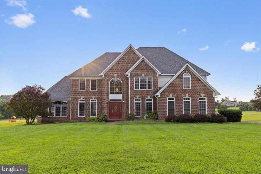Luxury. Comfort. Smart Living.
Nestled on a serene 3.32 acre lot, this exquisite brick colonial offers the perfect blend of elegance, modern upgrades, and everyday comfort. Just minutes from Route 32, Route 40, and 144 for an easy commute anywhere in the DMV.

Inside, a large two-story Foyer offset by a beautiful cascading chandelier and wooden staircase welcomes you and your guests home. Walk past the main-level office which could be easily turned into a 5th bedroom, and you'll find an oversized laundry/mudroom, a half bath and entrance to the gourmet eat-in kitchen with newer stainless steel appliances, an island cooktop, and brand new Bluetooth enabled double oven. The impressive two story family room is both cozy and spacious with a soaring stone fireplace that sets the tone for gatherings. Formal dining and living rooms, hardwood floors throughout, and elegant crown moldings elevate the living spaces.

Upstairs, the luxurious primary suite boasts sweeping views, a walk-in closet, and a spa-like bath with soaking tub and walk-in shower. Three additional spacious bedrooms offer comfort and style, with upgraded baths and Walk in closets in each bedroom!

The finished basement is an entertainer’s dream! Custom LED lighting, integrated Bose sound system, and walk-out access to the sprawling double deck to watch a dreamy sunset. Outdoor living continues with landscaped grounds on the most beautiful and flat lot, open space backing to trees, and a brick-paved driveway.

Smart Home & Lifestyle Upgrades: EV charging station, whole-house generator, invisible pet fence, and multiple app-enabled systems for lighting, HVAC, sound, and appliances. Endless storage closets throughout.

All major systems recently upgraded; Roof 2017, Dual HVAC 2018/19, Basement remodel 2020, Primary bedroom carpet 2024, Paint 2024, New Smart bluetooth dual wall ovens 2024, brand new cooktop 2025, New Laundry machines 2023.. and many more meaningful upgrades make this home move in ready. 

This is more than a home, it’s a private retreat designed for connection, convenience, and an elevated lifestyle.