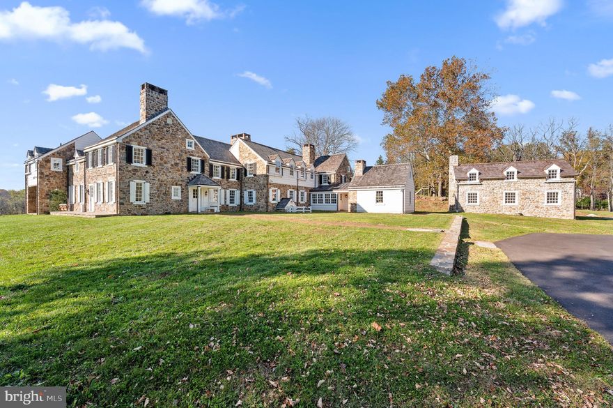 Unlike any other estate for sale in suburban Pennsylvania, the prestigious Ashbridge Farm manor consists of four remarkable establishments filled with everlasting history in the heart of Radnor Hunt. With 11.5 acres of land overlooking the Ashbridge Preserve, this captivating property showcases incredible views, diligent renovations, remote privacy, and impeccable details throughout. Built in 1732 with unique architectural elements and updated in the 1931 Brognard Okie renovation, this expansive premises will be sure to impress. 
As you drive up the secluded driveway to the grand Main Home, you are surrounded by acres of lush green grass and vibrant foliage. Enter through the front door and you are greeted by sun soaked rooms adorned in original wide plank antique wooden floors, installed over 300 years ago. The vast living room is completed by plaster walls with bull-nosed detail, a gorgeous wood burning fireplace with an original Okie mantel, a wall of large custom built-ins, deep windows, and ample natural light. French doors open to a covered outdoor terrace equipped with endless views of the property and antique beamed ceilings. 
Brilliantly completed with a restored walk-in fireplace, bright windows with bull-nosed detail, and access to the butler’s pantry/wine bar, the formal dining room is more than qualified for entertaining. Walk through the butler’s pantry and wine bar to find an expansive, gourmet kitchen designed by Waterbury Kitchens of Kennett Square. This five star kitchen is equipped with Caesarstone rugged concrete and zinc countertops with an integrated zinc sink, two additional sinks, an 8-burner Wolf professional gas range with dual ovens, SubZero refrigerator, freezer and separate refrigerator/freezer drawers, 3 Fisher Paykel and Asko dishwashers, Wolf steam oven, microwave drawer, and warming drawer, and a built-in vacuum system. 
The open kitchen, family room, and breakfast room enjoy two sets of built-in plaster finished banquette seating, stunning 1930’s original Okie addition stone walls, a wood burning fireplace, endless natural light, and access to the side yard through french doors. The family room leads to a second caterer’s kitchen, accented with a sliding barn door entrance. Take the antique brick-floored hallway to your sizable mudroom, laundry room, and family entrance. In this area, there is a powder room, reclaimed wooden beamed ceiling, double sink, and an ample storage space. Concluding the main level, there is a home-office with a wood burning fireplace and a second powder room. 
Take the private staircase to your second-floor primary suite boasting exposed stone walls, an Okie “Tower Room” private office, dual walk-in closets, laundry area, and a cozy sitting area. Built by Brandywine Plaster, the exclusive ensuite bath features two vanities, a soaking tub, and a rain shower. Three additional suitably sized bedrooms can be found via this level. Bedroom 2 enjoys use of an ensuite bath with custom tilework, while Bedrooms 3 & 4 share a full Tadelakt bathroom, bonus living space, and a laundry room.  The lower level offers a fabulous wine room constructed within the original Silver Safe  and brand new plumbing and electrical systems.
This property includes three additional establishments, referred to as The Tavern, The Barn, and The Guest House. The Tavern has beautifully designed living space with vaulted ceilings, a wet bar, 2 fireplaces, and a powder room. The Barn was completely gutted and renovated in 2014 by Griffith's Construction, showcasing a private driveway entrance, 2 fireplaces, 3 large bedrooms, 2 baths, a custom-designed Coventry Kitchen, and an oversized heated 4-car garage.  Recently renovated in June 2021, The Guest House was gutted and rebuilt with a first floor great room, custom kitchenette, full bathroom with a Tadelakt shower, and large second floor bedroom. An annually maintained red clay tennis court concludes the property.