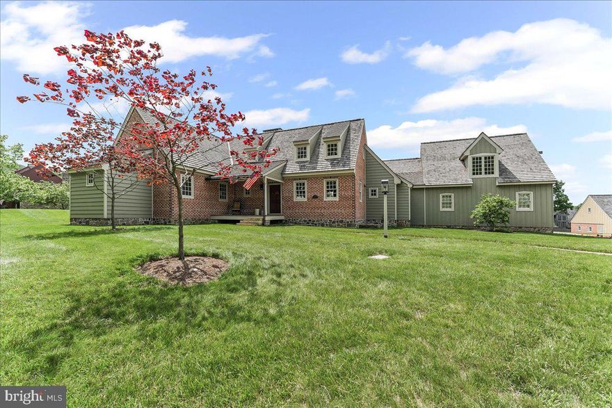 While it’s easy to focus solely on the individual home, it’s important to recognize that the thoughtful design and planning of the surrounding community are equally integral to its value and appeal. Located in the highly sought-after village community of Olde Bulltown in East Nantmeal Township, this exceptional brick, stone and wood-sided Colonial reproduction blends historic charm with the sophistication of modern craftsmanship.
Set on a beautifully landscaped 0.45-acre lot, the home offers a picturesque and tranquil setting. A welcoming brick walkway with bluestone steps leads to a covered front porch, accented with copper gutters and downspouts—an ideal spot to enjoy the peaceful surroundings.
Inside, the home opens to a warm, country-inspired kitchen that flows seamlessly into the dining area, offering front-to-back views that fill the space with natural light. Architectural details such as beaded board accents, a beamed vaulted ceiling, and quarter-sawn oak flooring in natural tones bring character and continuity throughout both levels.
The kitchen is a standout feature, blending barn wood finishes, soapstone countertops, a farmhouse-style sink, custom antique-painted cabinetry, and top-tier appliances to create a space that is both functional and full of charm. Two Rumford fireplaces, designed for heat efficiency, lend 1800s authenticity to both the dining and living rooms—the latter evoking the feel of a classic parlor.
The first-floor primary suite offers the ease of single-level living, with ample closet space and an ensuite bath finished in brick tile. Upstairs, a second bedroom and full bath—complete with a porcelain soaking tub—are enhanced by a loft-style space, adding both charm and versatility.
The finished lower level includes a large family room with plush carpeting, an office, a third bedroom, and a full brick-tiled bathroom. Stone-lined window wells allow natural light to filter in, creating a warm and inviting lower-level retreat.
Just off the kitchen, brick flooring leads to a powder room, laundry area, and interior access to the attached three-car garage—a rare feature within this community. The garage is fully insulated, finished with hand-sewn wood boards, and equipped with its own dedicated propane heating system, making it ideal for a workshop or year-round car storage.
Additional features include an energy-efficient geothermal heat pump, dual-zone climate control, and a whole-house generator, providing both cost-effective operation and peace of mind.
Step through the rear French doors to a covered all-brick patio, complete with a built-in propane grill and flue-lined chimney—a perfect setting for entertaining while enjoying unobstructed views of the French Creek Golf Club fairways.
Despite the peaceful, secluded location, the property is just a short drive from the many amenities, cultural events, restaurants, and attractions that Chester County and neighboring Lancaster County are known for.

About Olde Bulltown Village
Olde Bulltown Village is a distinctive community of reproduction period-style homes, thoughtfully designed to reflect the architectural integrity of the early 1800s. Emphasizing simplicity, craftsmanship, and quality, each home is constructed using authentic materials such as stone, wood, and brick, creating a cohesive and timeless streetscape.
Set amid the scenic grounds of French Creek Golf Club, and with Stonewall Golf Club just across the road, the community offers both natural beauty and architectural excellence. 
Olde Bulltown is more than a neighborhood; it's a thoughtfully curated environment that prioritizes aesthetic harmony, historical accuracy, and enduring quality.