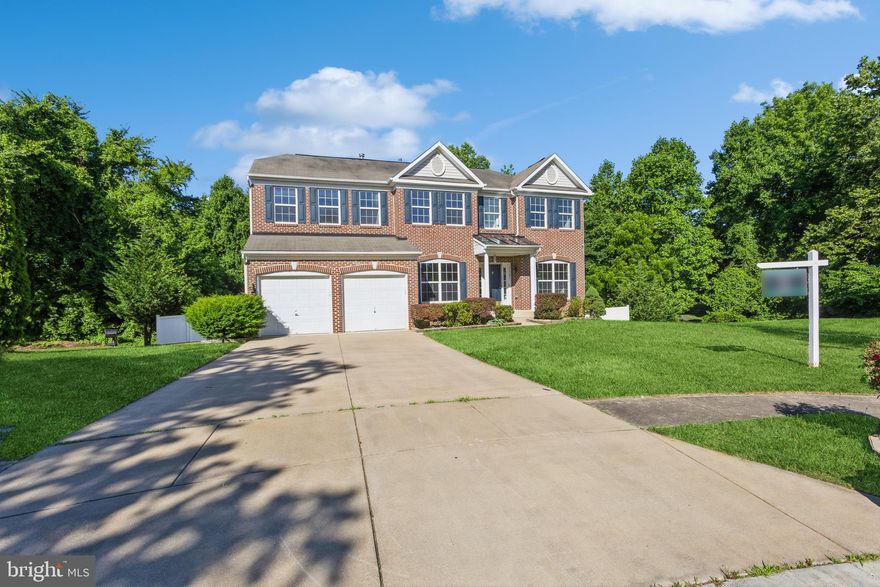 Welcome to 11701 Holly Hock in Upper Marlboro. Situated in a charming community on a serene cul-de-sac, this exquisite home boasts a brick façade and a two-car garage, complemented by an underground sprinkler system to maintain your lush green lawn.

Upon entering, you'll be greeted by gleaming hardwood floors and a breathtaking two-story foyer. The freshly painted interior exudes elegance and warmth. To your left, the formal dining room, adorned with crown and chair molding, is perfect for hosting sophisticated dinner parties and features custom storage solutions. Opposite the dining room is the formal living room, an ideal space for intimate conversations, also with hardwood floors and refined crown molding.

As you move towards the rear of the house, you'll be captivated by the expansive open floor plan. The stunning two-story family room, with its impressive stone fireplace stretching up the towering wall, is bathed in natural light from the large, magnificent windows. The adjacent upgraded kitchen is a culinary enthusiast's dream, featuring exquisitely designed cabinets, luxurious cambria quartz countertops, a spacious island, and brand-new stainless-steel appliances, including a refrigerator, dishwasher, and microwave. The kitchen also accommodates a dining area.

The adjoining sunroom, illuminated by two skylights and surrounded by ample windows, offers a delightful space for casual dining or relaxation. From here, step out onto the expansive deck, which includes an enclosed gazebo and stairs leading to a meticulously maintained vinyl-fenced backyard.

The main level also includes a private office and a convenient half bathroom. Ascend to the upper level, where brand-new carpeting extends throughout. The lavish primary suite features a walk-in closet and a beautifully updated en-suite bathroom with his-and-hers granite sinks, a Jacuzzi soaking tub, and a separate shower with updated tiles. The three additional spacious bedrooms, two of which have walk-in closets, and a renovated hall bathroom complete this level. For added convenience, the laundry room is also located on this floor.

Descend to the basement, affectionately known as the "man cave," where entertainment and relaxation abound. The entrance opens to a state-of-the-art theater room, perfect for movie nights, complete with a built-in platform for theater seating and integrated wall speakers. The expansive recreation room, enhanced by a bump-out feature and recessed lighting, offers limitless possibilities. Adjacent is a fully equipped wet bar, ideal for hosting sports events and parties. The basement also includes a legal bedroom, a fully updated bathroom, and new carpeting throughout. A sliding door leads to a patio, providing another inviting outdoor entertainment area.

The backyard is a private oasis, featuring a half-court basketball area, playground equipment, a large shed, and a backdrop of trees ensuring privacy. This remarkable property is a rare find and won't be on the market for long. Schedule a tour today and experience the unparalleled charm and sophistication of 11701 Holly Hock.