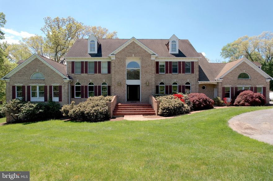Welcome to your dream home at 17 Brian Daniel Court in Reisterstown, MD! Situated on over 11 acres of picturesque land, this magnificent property boasts over 8,000 square feet of luxurious living space and a wealth of exceptional features. The marble-tiled foyer sets a sophisticated tone upon entry, while the soaring 9-foot ceilings create an airy and spacious ambiance throughout.  You'll find a host of luxurious upgrades, including new quartz countertops in the kitchen, primary bathroom, and three bar areas.The main level features the primary suite, offering a serene retreat from the world. Upstairs, three additional bedrooms and two full baths provide ample space for family and guests. The basement is a haven of entertainment, with a bedroom, full bath, weight room, pool table, bar, and screening area—all perfect for hosting movie nights or gatherings with friends. There is a 1 bedroom 1.5 bath in law suite that houses a full kitchen, washer and dryer and its own living space. The central vacuum system throughout the entire house ensures easy maintenance and convenience at every turn. The crown jewel of this home is a stunning concrete indoor heated pool complete with skylights and a hot tub. The pool room is a smart home, allowing you to control the pool heating, lights, and jets from your cell phone or tablet. With new epoxy flooring, this space exudes both style and functionality.
Outside, the screened-in patio attached to the deck provides the ideal spot for outdoor entertaining, while the two-level deck offers sweeping views of the expansive grounds. 

For horse enthusiasts, the licensed 3-stall stable on the property, known as "Woodland Stables," is a true gem. Custom-built in 2008 with impeccable finishes, the stable features surround sound speakers both inside and out, creating the perfect atmosphere for entertaining. The horse pasture boasts an automatic water system for the horses' convenience. A dog run attached to the horse pasture ensures that even your furry friends will feel right at home.
Backed by state property and the Liberty Reservoir, this home offers unparalleled access to miles of trails for hiking, horseback riding, and more.Additional amenities include a two-car attached garage with an electric plug for EV cars, a floor-to-ceiling stone wood-burning fireplace on the main level and a wood-burning stove in the basement. Don't miss your chance to own this extraordinary property—schedule your showing today and experience luxury living at its finest!