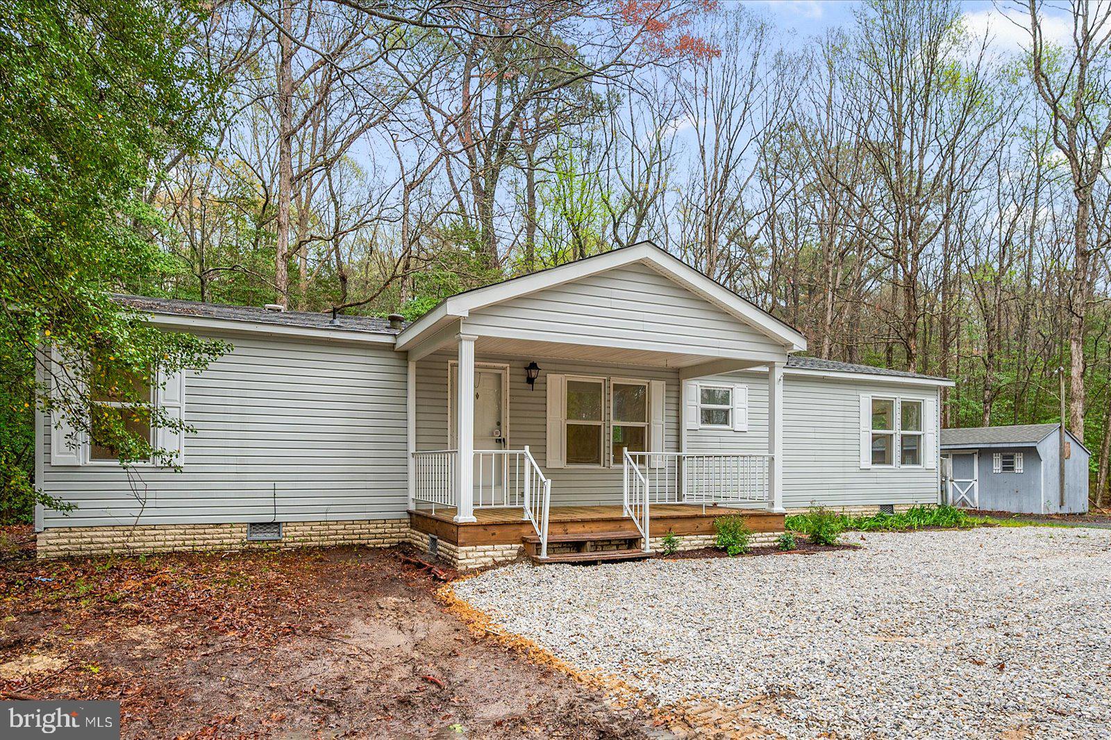 Discover the perfect blend of privacy and modern comfort in this newly remodeled three-bedroom, two-bathroom home, situated on 1.95 acres of serene, wooded land. This home features an open and inviting layout with luxury vinyl plank flooring, fresh carpet in the bedrooms, and a beautifully updated tiled master shower. The kitchen boasts marble countertops, stainless steel appliances, and ample storage, making it a dream for any home chef.
Enjoy the outdoors with a large wraparound deck and a screened porch, perfect for relaxing or entertaining while surrounded by nature. Additional features include new windows and HVAC for energy efficiency and a spacious laundry/mudroom with convenient side entrance access. Two outbuildings provide extra storage or workspace, offering endless possibilities.
Move-in ready and set in a peaceful location, this home is ideal for those seeking space, privacy, and modern upgrades. Schedule your private tour today!
This property is eligible for USDA financing.