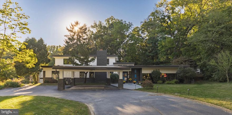 *Open House Cancelled 5/27/23
Mid-century modern home located in the highly sought-after Wynnewood neighborhood of the Main Line suburbs. Nestled on a private, almost one acre lot backing up to preserved woods and on a cul-de-sac street, this unique property offers the perfect combination of tranquility and luxury! This approximately 5,000 Sq/ft home is a true masterpiece of design, boasting high ceilings and walls of windows that offer plenty of natural light and allow you to enjoy the beautiful surroundings.

Upon entering this completely renovated home, you will immediately notice the stunning high ceilings, beautiful moldings, spectacular floors and abundant natural light streaming through the all-new Pella windows, providing an open and airy feel throughout.

The house features 5 to 6 bedrooms, 5 renovated bathrooms, and several possibilities for home offices, perfect for anyone who works from home. There are two primary bedroom suites each with their own ensuite bathrooms, providing ample space and privacy. Three of the bedrooms have en suite bathrooms, one on the first floor and two on the second floor! On the main level, the oversized sunken living room is ideally situated for entertaining, with an open floor plan, recessed lighting, and new floors. Step up to the formal dining room with polished marble flooring for special event gatherings. The separate library features wainscoting and a large stone fireplace, providing a cozy and inviting space for reading or relaxing. A great room complete with a wet bar, dual beverage/wine fridge and wood burning fireplace serves as a great day to day recreation area for everybody.

The heart of the home is the spectacular brand new kitchen, featuring luxurious quartz countertops, high-end Bosch appliances, a large contemporary refrigerator, and custom floating wood shelves. The kitchen also features not one, but two islands, with plenty of room for cooking and entertaining. The stunning tile backsplash and walk-in pantry, provides ample storage space for all your culinary needs, add to the overall elegance of this space, while the breakfast room is perfect for enjoying a meal or relaxing with a cup of coffee.

With ample space and a flexible layout, this property offers the perfect combination of comfort and versatility, providing five to six generously sized bedrooms and five bathrooms, spread across both the first and second floors.

All utilities have been upgraded allowing you to experience complete comfort year-round with the state-of-the-art multiple zone smart heating and air conditioning systems, designed to provide optimal temperature control and energy efficiency. Also added is programable outdoor landscaping lighting to enhance the curb appeal in the front of the home.

Step outside and discover your own personal oasis, complete with a semi-circular driveway and a convenient carport that accommodates over six car parking. As you explore the beautifully landscaped yard, you will be delighted to find a sparkling deep in-ground pool, perfect for hosting summer gatherings and creating unforgettable memories.

The magnificent approximate 1,000 square foot pool house is a true highlight, featuring a full bathroom, plumbing for a kitchen, and its own heating system, making it the perfect space for guests or hosting pool parties. The pool house also offers a cozy patio, providing a spot to relax and take in the serene surroundings while overlooking the breathtaking pool. With a completely fenced-in rear yard, this property provides the ultimate privacy and seclusion, allowing you to unwind and escape the hustle and bustle of everyday life.

Ideally located within close proximity to local playgrounds, hiking trails, public transportation, world class shopping including Suburban Square and easy access to all major highways to Philadelphia and beyond. Don't miss out on the opportunity to own this remarkable property, located in the award-winning Haverford Township School District.