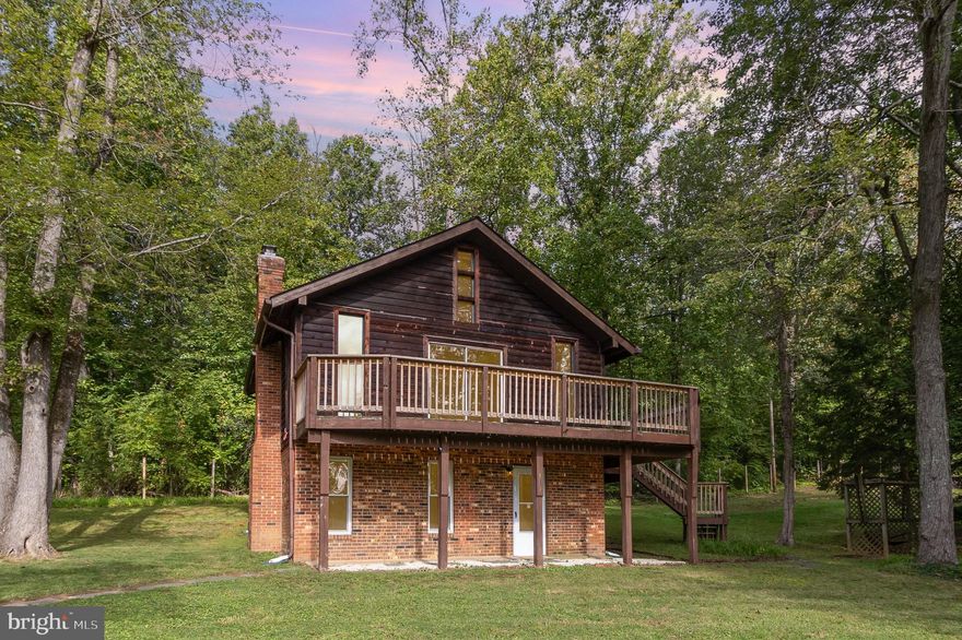 Escape to the tranquility of the countryside of Rappahannock County with this delightful rental home offering 2 bedrooms and 2 bathrooms with a third floor bonus room. This property is located in a tranquil and quiet area nestled on a spacious lot surrounded by nature's beauty that provides the perfect blend of rustic charm and modern comforts.  Both bedrooms are on the bottom floor and the main floor has a wrap around porch. Recent upgrades include a brand new kitchen, new paint, and new flooring. In the living room you'll see floor to ceiling windows that lookout to the countryside and a wrap-around deck. Don't miss out on your opportunity to rent this property and experience the countryside paradise. Landlord already has a contractor doing all grass cutting and trimming so that's one less worry to have when living in this beautiful home.

Property DOES have an oven. It was not installed when photographs were taken. Minimum credit/income qualifications are 670+ credit score and 3x rent in monthly income. No cats allowed on the property.