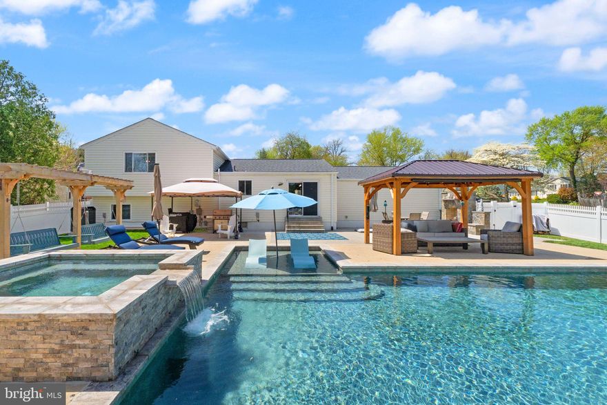 Welcome to an absolute gem  - you do NOT find a property like this in Leesburg often!  This home truly has the entire package - an AMAZING custom outdoor space with a high-end gunite pool and hardscaping, a lovely floor plan, prime location, and it's loaded with structural upgrades!  From the moment you walk up, you'll certainly notice just how much pride of ownership this home exudes.  No stone is left unturned on this home, and it shows!  On the main level, you'll enter into a spacious living room with high ceilings that makes you feel right at home immediately!  This is adjacent to a lovely dining room that flows right into a beautiful kitchen!  Enjoy beautiful white quartz countertops, high quality stainless steel appliances, and so much cabinet space. Upstairs you'll find 3 bedrooms and 2 bathrooms, including a primary suite complete with a recently remodeled primary bathroom, walk-in closet, and make-up station/bonus space!  The additional 2 bedrooms offer plenty of space, and share the recently remodeled hall bathroom.  Downstairs you'll be welcomed into a home-y recreation space - sit and relax by the beautiful brick fireplace with a wood stove.  You'll also find an additional space perfect for an office, more rec space, or more storage, plus a full bathroom and laundry room!  Heading down to the final level, you'll see endless possibilities - use this as overflow storage, an office space, rec space, guest suite, or all the above!  Now...let's talk about this outdoor space!  This backyard was COMPLETELY transformed in 2022 into what you see here - high-end custom 38' x 18' gunite pool with a tanning ledge, upgraded hot tub/spa with a waterfall, stunning travertine accents, oversized concrete patio perfect for relaxing and entertaining, beautiful pergola, outdoor porch swings, stone fireplace, and an outdoor shed!  The pool is chlorine, and heated of course!  As if you needed more, a huge bonus is that this home backs to the neighborhood's green space - it's community property and fully accessible as well!  The upgrades list on this home is long and includes new countertops (2025), kitchen appliances (2025), primary bathroom and hall bathroom renovations (2024), new windows (2024),  water heater (2023), gunite pool and backyard renovation (2022), high quality 21 SEER HVAC (2021) with whole house humidifier, expanded electrical panel, 50 amp exterior electrical outlet for RV/EV hookup, reverse osmosis machine with water softener, and a radon mitigation system.  The icing on the cake is the location - just 5 minutes from downtown Leesburg and everything Loudoun County has to offer, you're right in the heart of it!  Come see this one for yourself!