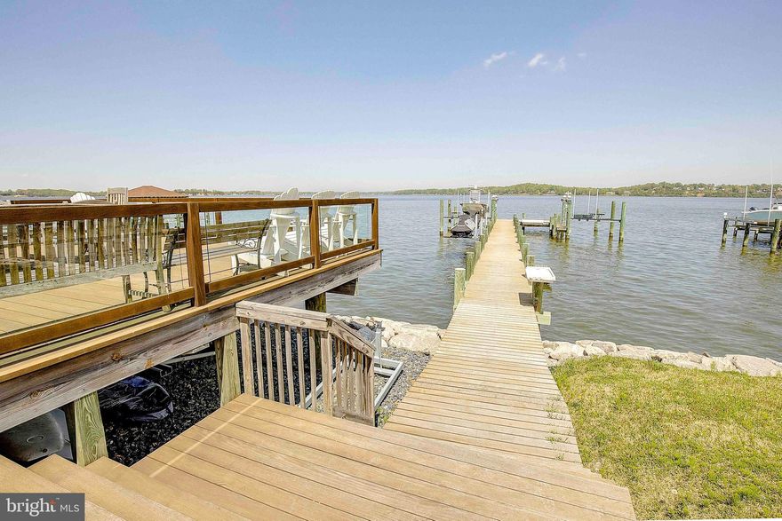 Nestled along the picturesque banks of the Magothy River, this exquisite luxury-to-be-built home crafted by the esteemed Whitehall Building and Co. With breathtaking views that embrace you from every angle, this 4800-square-foot sanctuary is the epitome of waterfront living. Every aspect of this residence has been meticulously curated, leaving no detail overlooked. Upon entering, one is greeted by luxurious wide plank floors that lead to a main level boasting 9-foot ceilings, setting the stage for grandeur and sophistication. The heart of the home, a gourmet kitchen with quartz countertops and backsplash, beckons culinary adventures with its oversized island and premium appliances. Molding details, including cove crown wrapping and custom beams, elevate the aesthetic, while a cozy gas fireplace with shiplap surround adds warmth and charm to the family room. Entertaining seamlessly transitions outdoors with a rear-covered porch, offering a perfect retreat to bask in the beauty of the waterfront.  Ascending to the second level, the primary bedroom commands attention with its awe-inspiring views, accompanied by a spa-like ensuite bathroom and a generous walk-in closet. Two additional well-appointed bedrooms, each with an ensuite, ensure privacy and comfort for guests, while a convenient laundry room adds practicality. The lower level boasts a fourth and fifth bedroom, full bath, and a versatile recreation room, catering to diverse needs and lifestyles. Outside, a sprawling deck overlooking the river and a magnificent 100-foot pier invite relaxation and leisure, while the sparkling pool is just the cherry on top,  transforming this residence into the ultimate entertainment destination. Seize the opportunity to transform this vision into reality and make this your dream home today. Co/perm lending is required, and with a generous $10,000 seller credit available for the use of an approved lender and title company, the path to ownership has never been more enticing. Contact the listing agent to schedule a viewing and embark on the journey to waterfront luxury living.