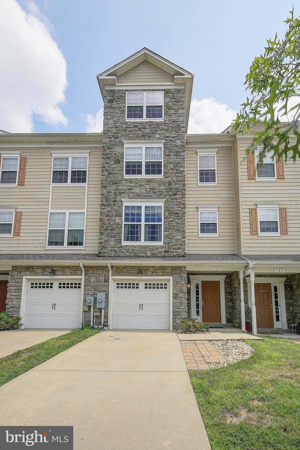 Beautifully maintained 4 level townhome located in the heart of Prince Frederick. ALL NEW PAINT THROUGHOUT! This 4 level interior townhome is situated with a deck over looking the community playground and 2200 Square feet of living space. The Owners suite located on the top level boasts a massive space with room for a large sitting area, vaulted ceilings, en-suite bathroom with separate water closet and spacious walk-in-closet. The third level has 2 bedrooms with walk-in-closets of their own and full hall bath. The main level kitchen has wall oven and built in microwave and large pass through to the main living area. Large dining area and family room lead out to a spacious deck that over looks the community playground. The lower level has a one car garage and another living area perfect for a man cave or play area. There is also a half bath on this level and sliding glass doors leading out to a fenced in area. This home will not last long!