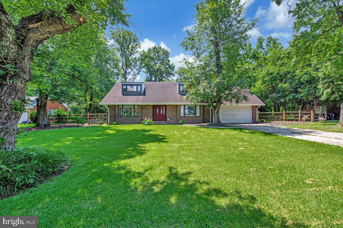 This Contemporary Style Detached Home offers Four Large and Spacious Bedrooms, Two Full baths, and a half bath in the sought-after Briarcroft community of Laurel, MD. This beautifully updated two-level residence combines contemporary charm with functional living spaces. Step inside to an open and inviting layout featuring distressed walnut wide-plank flooring throughout the main level. A spacious living room, flows seamlessly into the formal dining area, overlooking a large backyard and rear patio. The heart of the home is the beautifully upgraded kitchen, featuring solid wood cabinetry, granite countertops, stainless steel appliances, and a breakfast bar. The home’s outdoor space is a true retreat, featuring a beautifully landscaped backyard plenty of space for summer time retreats. Conveniently located between Baltimore and Washington, D.C., this home provides easy access to major highways, the MARC train, and Greenbelt Metro. Move-in ready and designed for today’s lifestyle