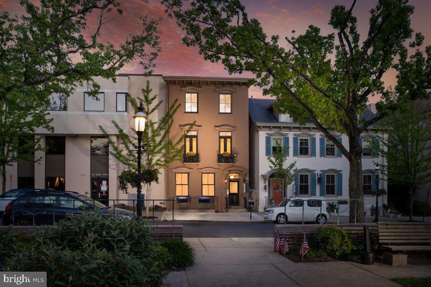 Park views, restaurants, cafes, museums, all just steps away in this small town with a big city feel. The best living is created here at 20 E Court. MUST SEE to appreciate the living space, natural light and ceiling height. Featured in Philadelphia Magazine in the heart of Doylestown Boro, this gorgeous 2 bedroom, 2.5 bath Pied a Terre is literally steps to  anything you desire.  This 2300 + square foot one-level living  sprawls the entire length of a beautifully restored Historic building and is updated with the  finest amenities that exude both luxury and  function.  The artful mix of the old and new is done in the most tasteful and unique fashion. Take a private elevator up to your unit and experience the light filled, open- concept lifestyle that is completely on trend while paying homage to the buildings history.  Each of the large-sized bedrooms feature their own private en-suites with floor to ceiling tile work, and custom closets throughout; you will be amazed at the space and openness as you walk through. In the front sits an extra large great room with hardwood floors, soaring ceilings, a heat producing electric fireplace and 2 gorgeous Juliet balconies that overlook the lovely park and views of the Old Courthouse. This is the perfect place to open the doors, step out and listen to the live  music which occasionally plays on the streets of Doylestown.  Its spacious feel makes it a perfect place to entertain lots of guests and host special holidays. The new kitchen features quartz countertops, a stunning tile backsplash, white cabinets with a contrasting dark island, 2 ovens, and an island with a microwave built in. The kitchen sits directly next to the great room and also features room for an expandable table as well as a breakfast bar. A huge walk in pantry is a bonus, rarely seen in apartment/condo living. Travel down the hall and you will see a lovely powder room with a quartz top vanity and beautiful neutral gray ceramic tile. The two bedrooms are separated by a long hallway leading to the back of the building and creates the feel of separate wings in this home, fabulous for privacy along with a sense that you're in a large sprawling space. Both bedrooms are large enough to accommodate king size beds if desired. Toward the back of the home you will see 2 flex spaces. One is utilized as a den/office area with a built in workspace as well as an area to settle in on a comfy sofa and watch TV or listen to music. The second flex space offers comfort for reading or relaxing with the beauty of natural light streaming through. There is a multitude of opportunity in these spaces to create whatever suits your lifestyle. The full laundry room with built in custom cabinetry and storage is situated very conveniently right off of this dressing area just steps from the Owner’s Suite. Featuring lots of natural light from the beautiful windows all around the space, this bedroom feels like a retreat. With hardwood floors that match the rest of the home and an on-suite with radiant heated floors, a double vanity with quartz top, a separate commode area, a large custom walk in closet and a frameless glass shower with a tile bench, you will feel like you are at a luxury hotel when in reality, you are in your bedroom. This is luxury living and ease at its best. One floor living with every amenity you want in Newsday’s top-rated small town. Easy access to Philadelphia and NYC, the best of both worlds, Doylestown offers big city amenities and walkability with a small town community feel.  Imagine enjoying fine dining as your favorite neighborhood  dinner spot, sidewalk seating at the family- owned cafes where you can enjoy cappuccinos and pastries, or a refreshing gelato, a chocolatier where you can indulge in the most delectable truffles.  Friends will enjoy your introduction to the Speak-Easy style bar where cocktails are unique and engage all your senses.  This is not just a home, it is  a lifestyle
