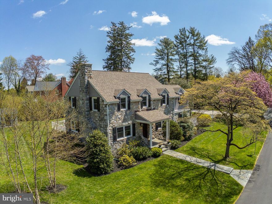 Welcome home to 229 Devon Boulevard located in the heart of Devon within walking distance to the Devon Train Station, Devon Yard, Devon Horse Show Grounds, Radnor Trail, and Whole Foods. This beautiful colonial was built in 1940 with stone on all four sides, beautiful hardwood floors, deep window sills and tons of charm. The house is sited on a beautiful .41 acre flat corner lot with mature specimen trees as well as new landscaping surrounding the house, deck and patio.     The current owner has expanded and updated  inside and out; new roof, siding, gutters, exterior lights with sensors and timers installed during the renovation in 2015 to expand the Master Bedroom and open the Dining Room to add a Trex deck and flagstone patio. A new master bath with sliding barn door, walk in closet with sitting area fully outfitted by Closets by Design, 2nd floor deck and fireplace were added to the owners suite. Hardwood floors were refinished throughout and lighting was updated. Enter from the charming front porch to the Living Room with wood burning fireplace surrounded by whitewashed brick and custom built in shelving. Into the Dining Room where a window was replaced with a new sliding door so a spacious Trex deck could be added with steps down to a new flagstone patio. The adjoining kitchen with breakfast area has beautiful wood cabinetry, stainless appliances and granite counter tops. From the kitchen you can access the back patio, the attached garage and a staircase down to the large basement with Laundry and storage; it is fully waterproofed and plumbed for a future bathroom.Take the beautiful wood staircase to the second level with refinished hardwood floors, custom window treatments, and new ceiling fans. The Master Suite on the right offers all of the amenities buyers are looking for today. Two additional bedrooms, hall bath and linen closet complete this floor. The walk up attic is accessed through the large 3rd bedroom.