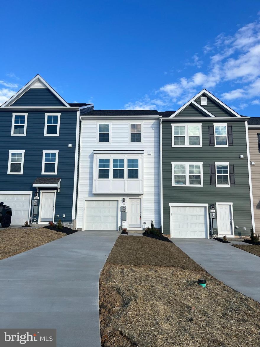 DRB Homes Overlook at Riverside - For GPS: The Property is in Next to this address: 88 Mossdale blvd FALLING Waters, WV 25419...Next to Children / Dog Park - Brand New Town Home 4 Bed Rooms, 3.5 Bath, Upon entry of this wonderful townhome, a finished rec room (can use as a 4th Bed Room) with a full bathroom. The main level offers luxury vinyl plank flooring throughout and a spacious living room with a powder room. The eat-in kitchen features an island, Quartz countertops and stainless steel appliances. The spacious primary suite features a generous walk-in closet and an en suite bath with a dual sink vanity and an oversized seated shower. Two secondary bedrooms & full bath, a linen closet and a centrally located laundry complete the upper level! Set in a wonderful new community, Dog Park, Children's park, Basket Ball Court, Tennis Court, and Recreation sit up area are free amenities. In a prime location for I-81, Rt 11, I-70 commuters, mountain views, walking distance to shopping, and restaurants, access to Spring Mills schools, and close to interstate just minutes from the MD line. This rental may not last long.