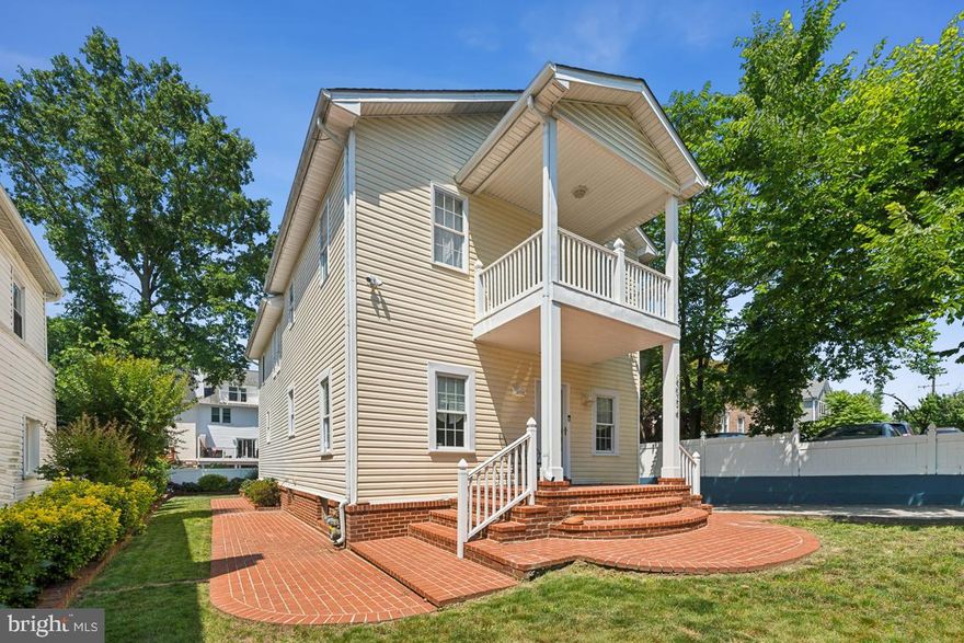 Welcome to 2034 S Shirlington Rd! This well-maintained SFH has been expanded, renovated and drenched in sunlight. As you approach the entrance, take a moment to admire the exquisite brickwork of the stately front porch and the charming wraparound built-in garden beds—a true gardener’s delight. There are 3 finished floors with numerous significant upgrades:  New Roof with gutter guards (2023), Dual zone HVAC (upper AC replaced in 2023), Newer Water Heater (2024), Rear fence (2019), and new sump pumps (both internal and external to ensure full waterproofing, 2024). Upon entering, you will be greeted by the airy 9ft ceilings throughout two levels and the gleaming hardwoods. There is a bright formal LR, a formal dining room which communicates with the gourmet kitchen (renovated in 2014) with elegant beaded inset cabinets, soft close drawers, display shelves, a built-in wine rack, and SS appliances. Off the kitchen, there is an oversized Fam Rm which can easily be divided with a simple wall to create a main level bedroom. Get ready to grow old in this home as there is also already a full bath and laundry room on the main level. Upstairs, you can retreat to the master suite oasis complete with a master bath with a deep sitting tub, a sep shower and a double sink vanity . The huge master has space for a dressing room, office or den area. Upstairs you will also find two other generously sized bedrooms and the 3rd full bathroom. The East-facing bedroom has wood floors and its own covered balcony. The lower level has space for guests to comfortably have longer stays as it has its own full bathroom (full bath #4), kitchenette area, sleeping and living quarters. Venture out back to the lovely flat lot with a side patio area, a large storage shed, and the 3-car driveway. Just blocks from Columbia Pike's great restaurant scene and Shirlington. An easy commute off Glebe to I-395, the Ballston-Rosslyn corridor, Amazon HQ2 (Metropolitan Park), The Pentagon, Mark Center, and into DC, whether it's for work or play! Speaking of play, Drew Park Playground & Sprayground, Fort Barnard Park and Monroe Park are all within walking distance! Run, don’t walk as this beauty won’t last!