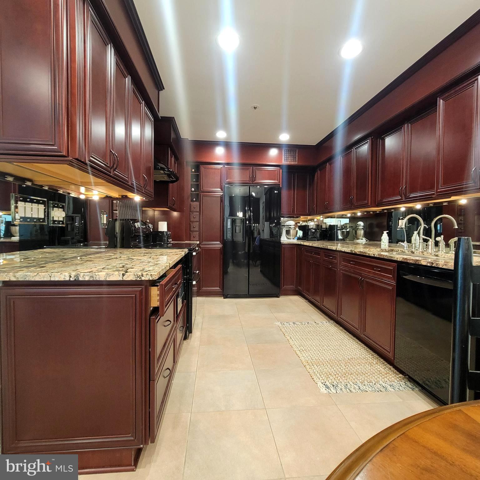 Welcome to the tranquil community of Summerview Way in the wonderful Riva Trace neighborhood! This 2-bedroom, 2-bath, 2-level condo features vaulted ceilings and wood-burning fireplace in the living room opening up to a cozy sunroom for enjoying your morning coffee to start your day or diving into a good read on a rainy weekend. The updated gourmet kitchen features recessed lighting, modern black appliances, ample storage, and granite countertops that extend into the butler's area in the dining room. Both bathrooms have been updated to create a spa-like experience with glass shower doors, recessed lighting, ceramic tile surrounds, and of course, heated floors! The primary bedroom features a large walk-in closet, plantation shutters, and connects to your private terrace overlooking a forested area. The upper level features a separate office area, family room, and wet bar. This unit is so unique you'll love the way it feels! Riva Trace residents enjoy peaceful strolls, a game of tennis, or a relaxing afternoon kayaking on Ginger Creek. Annapolis is just minutes away for waterfront dining/shopping and is an easy commute to DC.