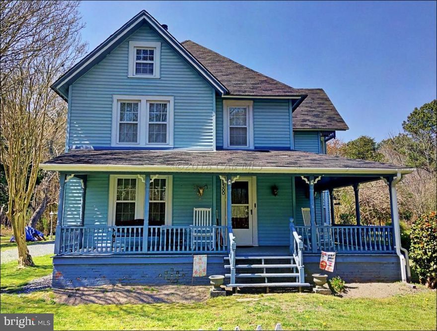 Sit on the wrap-around front porch of this well-maintained home that combines the charm of history with modern touches, while being nestled on 1.41 acres. Beautiful original hardwood floors flow throughout the first floor, excluding the kitchen. Updated bath, newer carpets upstairs, vinyl windows and insulated walk-up attic also completes this home. Outside, you will find a large detached garage that includes a covered lean-to and a work shop with pull down stairs for storage. Adding to the outside charm of this home is a real working crank and bucket wishing well along with a fish pond.