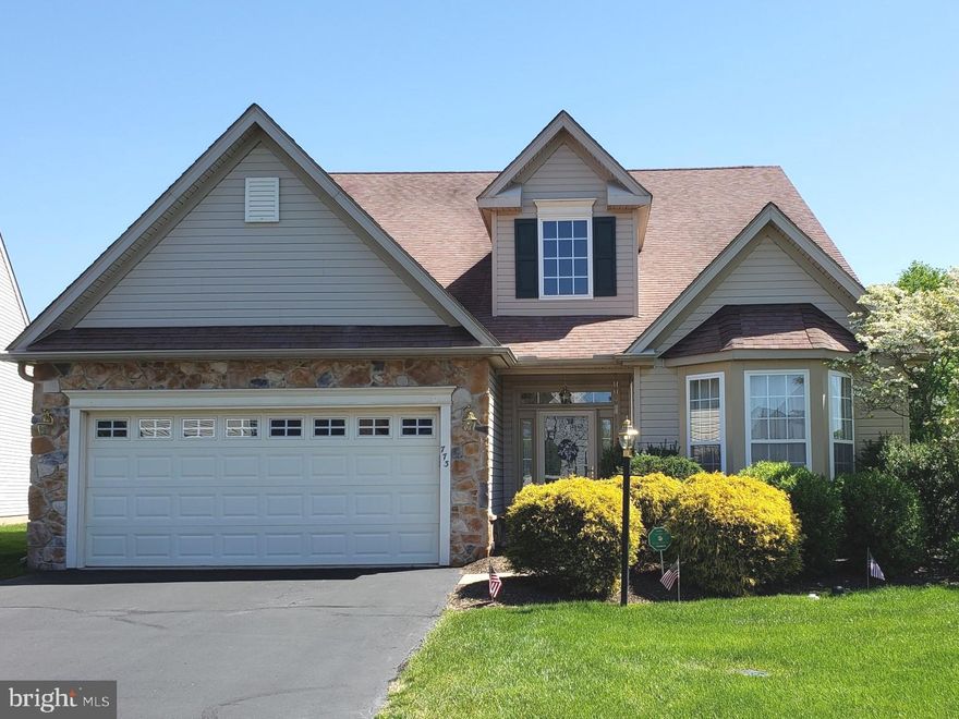 Here is your opportunity to own an exceptional Radnor model home in the award-winning Traditions at Skippack active adult community. The home is located on a highly desirable perimeter, corner lot with nearby overflow parking for guests. The spacious entry foyer provides a welcoming view of a very expansive and tastefully decorated, and carpeted living and dining area. The beautiful hardwood foyer area leads to a bright and spacious kitchen with a peninsula island, and a very comfortable dining area. The classic kitchen features beautiful, white cabinetry, Formica counter surfaces, and coordinated white appliances. A peninsula island provides additional workspace for culinary activities. The kitchen area also includes coordinated built in desk and cabinetry for home business activities. The convenient, adjoining, large family room is a wonderful area to just relax, or to entertain guests. This room also features a tan marble faced gas fireplace in the family room for cozy winter days.  Adjoining the family room is a bright and cheerful sunroom with many windows to enjoy the secluded wooded rear view.  A large deck is conveniently located off the sunroom and provides a beautiful view of the wooded common area space. It is a great area to entertaining and enjoy grilling in the warm weather. The primary bedroom and bath suite are also conveniently located on the first floor. The primary bath includes a corner soaking tub, a stall shower, and double vanity.  The first floor also provides a sizeable second bedroom, and full bath for your guests. The spacious second floor loft area provides ample space for a sitting area to relax, or for a convenient office area. The second floor also includes a third guest bedroom and full bath, with neutral tile flooring and vanity. The HVAC system is 2.5 years new to provide many years of winter and summer comfort. The washer and dryer are brand new in 2022, and the stainless steel refrigerator is only 3 years old, and the hot water heater just replaced in June 2022. The community amenities include an expansive clubhouse with library, exercise room, a billiard room, a large, heated pool for your guests to enjoy with you, and a full kitchen and community room. Also included are a tennis and pickle ball court, and a paved walking path surrounding the community. The community is minutes away from the popular Providence Town shopping center, that includes Wegman's, and many shopping, entertainment, and dining facilities. Also close to the charming Village of Skippack with its delightful shops and many restaurants. The PA Turnpike and Route 422 are only minutes away. Don’t wait, this exceptional home will not last long!