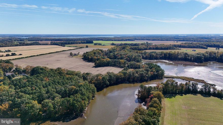 Discover one of Talbot County’s rare farms that combines productive farmland, waterfront, and exceptional recreational opportunities. This 105.72-acre agricultural property features approximately 80± acres of tillable ground and is well suited for continued farming, income production, or long-term land investment. The open farmland is framed by wooded perimeter lines with a mixture of mature hardwoods and softwoods, including pine and oak, providing privacy, scenic beauty, and excellent wildlife habitat. The property is zoned agricultural, offering flexibility for farming, recreation, or investment use.

The tillable acreage carries an overall NCCPI rating of approximately 57.3, indicating solid, productive ground suitable for row crops, small grains, and conservation programs.

The farm boasts over 2,500 feet of water frontage on Miles Creek, offering excellent duck and goose hunting opportunities. The property is located on a known migratory flyway for ducks and geese along the Chesapeake Bay, making it a proven waterfowl destination.

A network of trails through the wooded areas leads to a cleared waterfront area on Miles Creek featuring a dock and picnic table, ideal for family activities, swimming, and fishing. A small point along the creek includes a strategically placed booby blind, positioned for effective duck and goose hunting. Additional amenities include multiple duck blinds on Miles Creek and a goose pit.

The historic two-story farmhouse, dating to the early 1900s, offers five bedrooms and one full bathroom and features a new roof and siding. Beginning with the main floor, the home offers a large living room, dining room, kitchen, and the first of five bedrooms. The second floor includes four large bedrooms and a full bath. The residence is accessed by a private driveway off Saulsbury Road, providing convenient access while maintaining a high level of privacy. A small shed next to the home provides additional storage.

This property is income-producing, with revenue potential from farming operations, CRP enrollment, and hunting leases, making it a versatile investment opportunity, productive farm, or private recreational retreat with waterfront access.

Property is being offered through a sealed bid process. All bids must be submitted by February 26th  at 5PM. Bids will be reviewed after the submission deadline. Seller will not respond to offers prior to that time.