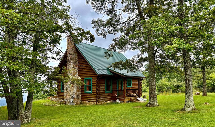 “LAST CHANCE” INVESTMENT! A COMPLETELY SECLUDED 2 STORY, 2 BEDROOM, 1 BATH (24 X 30) LOG CABIN ON 271 ACRE MOUNTAINTOP RETREAT. CABIN OFFERS LIVING ROOM WITH 20’ STONE FIREPLACE (FATHER AND SON BUILT WITH MOUNTAINTOP ROCK), DINING AREA, COMPACT KITCHEN W PORCELAIN DBL SINK & T&G KNOTTY PINE FLOORS, PICTURE WINDOW, BEDROOM, FULL BATH AND OPEN LOFT.  PROPERTY ALSO INCLUDES DETACHED GARAGE, WORKSHOP AND BRAND-NEW GUEST CABIN W LOFT, T&G KNOTTY PINE WALLS AND CATHEDRAL/BEAM CEILINGS.  OTHER AMENITIES: SOLID OAK DOORS, BEAMED CEILINGS, COVERED FRONT AND REAR PORCHES, ELECRICITY PROVIDED BY GENERATOR (IN BOTH CABINS), METAL ROOFS, WELL WATER AND SEPTIC TANK.  PLUS (SIX) 6 WIND TURGINES ON SITE, APPROXIMATELY $40K ANNUAL INCOME!  MOUNTAIN FOLD PRIVATE ROAD WITH GATED SECURITY.  ENDLESS MOUNTAIN VISTAS FROM REAR DECK.