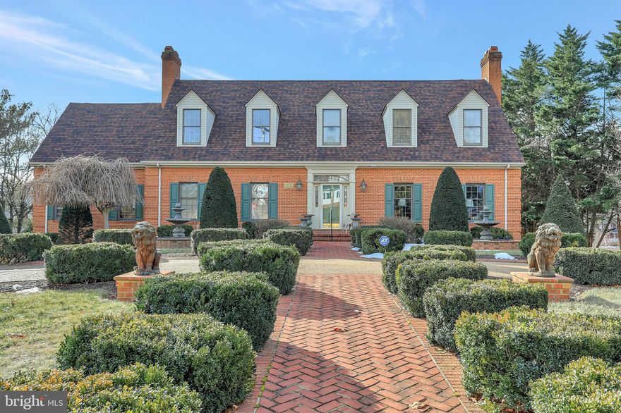 Welcome to 218 Jamestown Rd!!!  This custom all brick Cape Cod style home is located on 2 large lots in a gorgeous park-like setting complete with concrete aggregate driveway, brick sidewalks, meticulous landscaping, and a gazebo.  Once inside, you will find many quality upgrades such as hardwood & tile floors,  gourmet kitchen with granite countertops and stainless steel appliances, formal dining room, formal living room, and a large den with a beautiful brick wood-burning fireplace.  The primary bedroom with en suite bathroom, the laundry room and a half bath are also on the main level.  Upstairs you will find a second primary suite featuring a jetted soaking tub and a sauna, plus two additional bedrooms, and a full guest bathroom. On the lower level, there is a large rec room with laminate flooring, a full bathroom, storage room, and 3 car garage.  There is plenty of room for parking and storage with an oversized detached two car garage with loft above.   The backyard oasis is perfect for entertaining with a deck and large brick patio ready for your hot tub.  Great commuter location close to I-66, shopping, hospital, schools, & restaurants.  Come enjoy all the valley has to offer - wineries, golf courses, Shenandoah River, Skyline Drive, Skyline Caverns and much more.