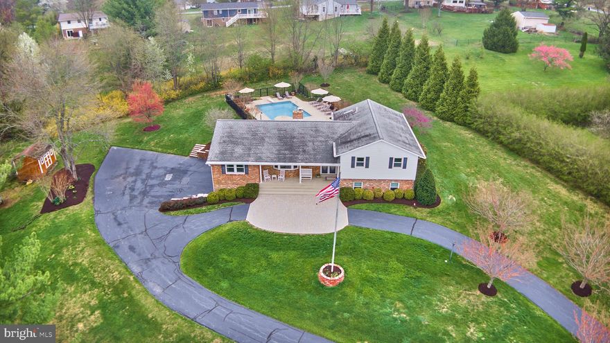 Entertainers Dream!  Experience breathtaking valley views and frequent wildlife sightings from this surprisingly spacious home, designed for both privacy and modern comfort. Lower level bonus room makes an excellent option for a 4th Bedroom.  The updated interior features a chef's kitchen (2017), stylishly renovated baths (2017), rec room flooded with natural light. Work from home in a dedicated office with heated floors (2017) or retreat to the private backyard oasis, where the swimming pool (renovated 2019) enjoys 12+ hours of daily sun and easy access from the kitchen and bedrooms. Significant mechanical updates provide peace of mind, including a 2024 well pressure tank, 2016 HVAC and water heater, and updated roof and windows (approx 2013). Storage is abundant with a true 2.5-car garage featuring a specialized wine room, plus a large shed for pool equipment. Complete with a central vacuum and a maintenance-friendly septic system, this move-in-ready retreat perfectly balances functional upgrades with a serene setting.