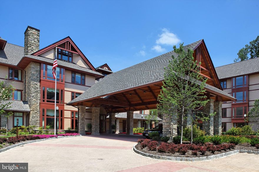 Welcome to Fox Hill - an award winning gorgeous 60+ independent and vibrant living community.  Fox Hill offers so many amenities at your disposal affording  you the opportunity to live life to the fullest! You can socialize and participate in amazing activities including world-class dining options, lectures and classes, a full-service spa, art studio, library, golf simulator, fitness club and pool, lovely bar, field trips, games and movies and so much more.  Return to your own beautiful oasis within the community - a grand corner condominium featuring two large bedrooms, a bonus/flex room, a sunroom/den and a large open living/dining room with an attached gourmet kitchen.  Huge windows look toward the trees and allow for abundant natural light.  Upgrades abound from the beautiful wood floors, recessed lighting, stunning hand-blown glass chandelier, brand new stainless steel kitchen appliances, custom granite counter tops featuring a breakfast bar, and built-in bookshelves in the den and on either side of the beautiful gas fireplace in the living area . A large balcony off of the dining area is the perfect place to have your morning coffee and get ready for the day.  Originally designed as a three bedroom condo, alterations were made to allow for a bonus room instead that could be used as an office, sitting room, etc., entering the primary bedroom.  This allows for even more closet space in the primary bedroom complete with  extensive custom closet storage. New carpets in the bedrooms and fresh painting throughout.  There is easy access to your assigned garage space via the elevator just across the hall.  There is also a small storage unit included.  So many reasons to call Fox Hill, and this particular unit, home!