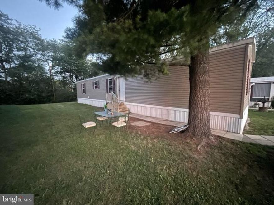 Easy living at an amazing price! Don't miss out on your chance to make this mobile your new comfy home - featuring 3 bedrooms with the primary bedroom separated from the other two and offering a walk-in closet and primary bath, a main full bath, laminate flooring throughout with vinyl flooring in the baths, and separate laundry room. Only 7 yrs old! Ground rent is $565/month (includes trash/recycling) and buyers must be approved by Lakeside Management. Application fee is $35 per adult.