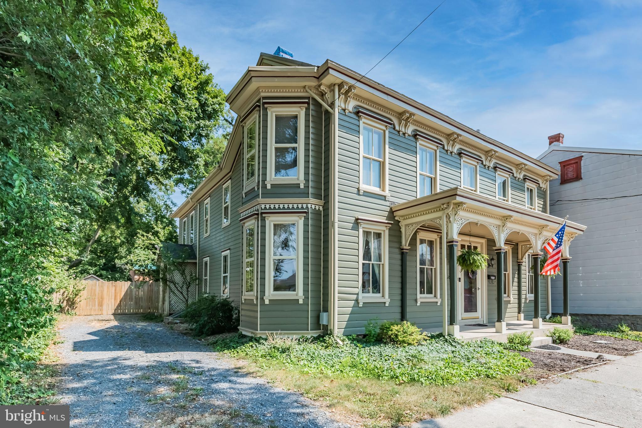 This 3,206 square foot Victorian beauty has been loved by the same family for 50 years. Property has so much to offer with an apartment or in-law quarters plus a detached carriage house including a finished office (or could become she shed, man cave, recreation, crafting space) PLUS storage, expansive unfinished second story that awaits your ideas, and potential for garage or possible additional income. Current owners have painstakingly and meticulously renovated while maintaining the graceful integrity of a bygone era. You'll love the  charming features such as wainscoting, transoms, and dual staircases. Rich pine flooring in the updated dining room makes the perfect place for creating memories around the table. Comfortable front living room boasts new carpet and a soothing paint palette. The awesome kitchen is warm and welcoming with wood cabinetry & flooring, granite counter tops, large island, decorative fireplace, and gorgeous original built-in storage. Fresh paint and new carpet bedeck the family room where sliding doors lead to a large rear deck (also newly painted). First level also includes a full bath and newly remodeled laundry/mechanical room which gives access to the side driveway. Second story houses 5 bedrooms and 2 more full baths. Three bedrooms and one bath are in the main house with two bedrooms and 1 bath in the apartment. You can easily open the archway that separates the two spaces OR continue to collect monthly rent from the apartment to help offset the flood insurance. (Apartment/in-law quarters have a separate entrance as well, plus it's own living room and kitchen!) Other important updates that have completed is all the electric has been updated and plumbing is upgraded to PEX. Efficient natural gas heating, cooking, and water heating. Fiber optic internet.  Storage shed in the fenced backyard with mature trees to give cool shade and some privacy on the oversize .34 acre lot spanning from East South Street to Chapel Alley allowing alley access and off-street parking.  Conveniently located in the historic district so it's a quick walk to Letort Park and all things Carlisle has to offer!