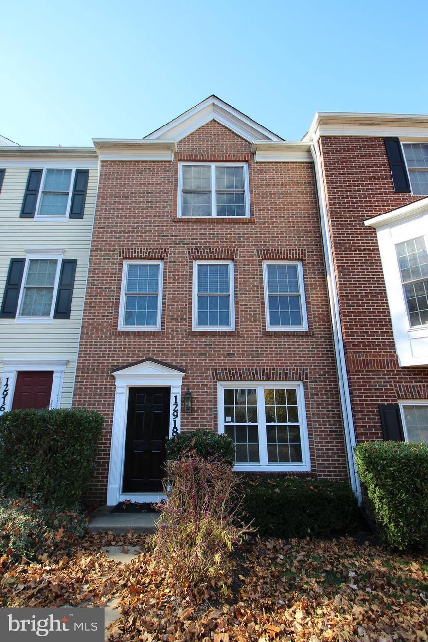 Welcome to this beautifully refreshed three-level townhouse nestled in a serene, park-like setting. Offering three levels of above-ground living space, this home features brand-new carpet and fresh paint throughout.

The ground level provides exceptional flexibility with a spacious recreation room or home office, a convenient half bath, a laundry/mechanical room, and access to a one-car garage. The main level is ideal for everyday living and entertaining, featuring a large living room, a dedicated dining area, and an adjacent kitchen with a functional layout.

Upstairs, you’ll find a generously sized front-facing primary bedroom, a full hall bath, and two additional bedrooms overlooking the rear of the home. Additional highlights include a one-car driveway behind the home and a charming front courtyard complete with a tot lot and covered seating area. This sought-after townhouse community directly borders a park, offering a peaceful atmosphere with easy access to outdoor recreation.