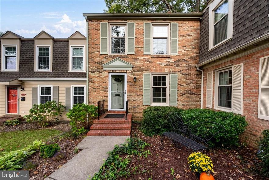 This charming all brick end-unit townhome is nestled in a private enclave in the sought-after neighborhood of Georgetown.  The first floor features a newly remodeled  kitchen with stainless steel appliances, granite countertops, white cabinetry, a walk-in pantry, and a large peninsula for meal prep and enough seating for five.  It also includes a dining room off of the kitchen with entry to the private fully-fenced courtyard; new luxury vinyl tile LVT flooring throughout; a half bath; and an expansive living room with charming wooded views.  The second floor boasts three large bedrooms, two full baths, plenty of closet space, and pull-down stairs providing access to additional storage.  The basement includes a spacious family room with a wood-burning brick fireplace, a laundry room with ample storage, a separate bonus room/office, and new LTV flooring throughout.  The community of Georgetown is conveniently located near parks, pools, restaurants, shopping, and public transportation. Commuters will love its proximity to Washington, Baltimore, and Annapolis.