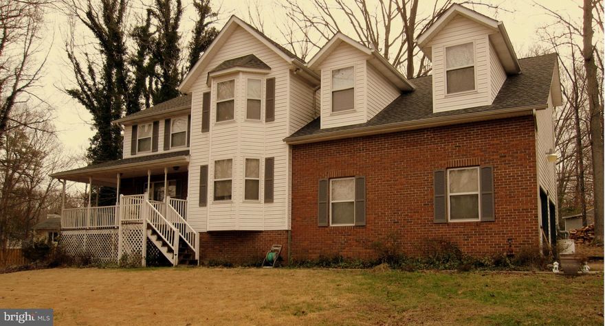 Lovely Colonial very close to Rousby Hall Entrance Recently renovated kitchen, with granite counter tops and stainless steel appliances. Wood burning fireplace in family room and gas fireplace in living room. Newer roof and heat pump. Nice lot on cul-du-sac Wraparound porch and rear deck. 2 car garage Lots of storage Central Vacuum all this and Water Access Community which includes lake and beach