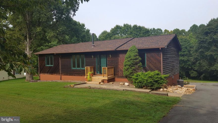 REDUCED!! DC SIDE OF WARRENTON. Open floor plan in this rambler on over 1/2 acre with huge deck for entertaining! New paint and carpet! Some appliances recently replaced.  Master suite has large tiled shower and double vanities.  Two additional Bedrooms w/ bath on upper level.  Basement is a work shop and garage.  Great for the handyman or for storage- can be finished for rec room!