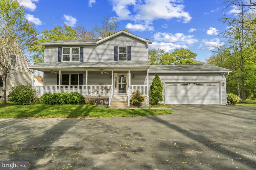 With a breezy front porch, bright and easy layout, and a big backyard ready for anything, this coastal-style colonial in the water-oriented Turkey Point community offers up to 4 bedrooms, 3.5 baths, and over 2,000 square feet of finished living space, all situated on nearly half an acre. The main level features refinished hardwoods, spacious living room, and an open kitchen with quartz countertops, stainless steel appliances, pantry, and a breakfast bar peninsula that seamlessly opens to the sunny dining room. New sliders lead to the recent, easy-care composite deck with vinyl rails, a brand-new awning, and a perfect view of the sweeping rear yard. A convenient half bath and access to the attached 2-car garage add function and flexibility to the main level. Upstairs, newer hardwoods run throughout. The bright and airy primary suite offers an oversized walk-in closet with organizer system, and a beautifully finished en-suite bath featuring dual vanities and a step-in shower with stylish stone flooring. Two additional well-sized bedrooms and a second updated full bath complete the upper level. The fully finished lower level includes a family room, office, potential 4th bedroom with closet and window, full bath with tub shower, and a spacious laundry room with utility sink. The 2-car garage is generously sized and includes attic storage, built-ins, and access to the rear yard. Recent updates include: HVAC (2023), basement remodel with LVP flooring and an updated laundry room (2021), deck and sliders (2021), remodeled primary bathroom (2020), refinished main level hardwoods (2025), new front door, gutter system, and sump pumps. Located just minutes from Turkey Point Park, Marshy Point Nature Center, Rocky Point Beach, and Cox’s Point Park, this home is ideal for outdoor enthusiasts who love kayaking, hiking, fishing, and sunny days by the bay. An unmatched location that offers the best of both natural beauty and everyday convenience, with easy access to 695, 95, and the shopping and dining of downtown Essex. Freshly painted in a timeless, tranquil neutral and thoughtfully updated inside and out, this move-in ready home offers a rarely found balance of style and simplicity.