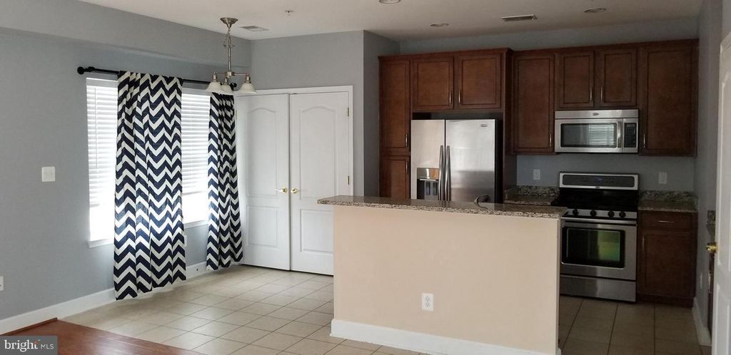 Photo of 13595 Station Street, GERMANTOWN, MD 20874 (MLS # MDMC2203272)