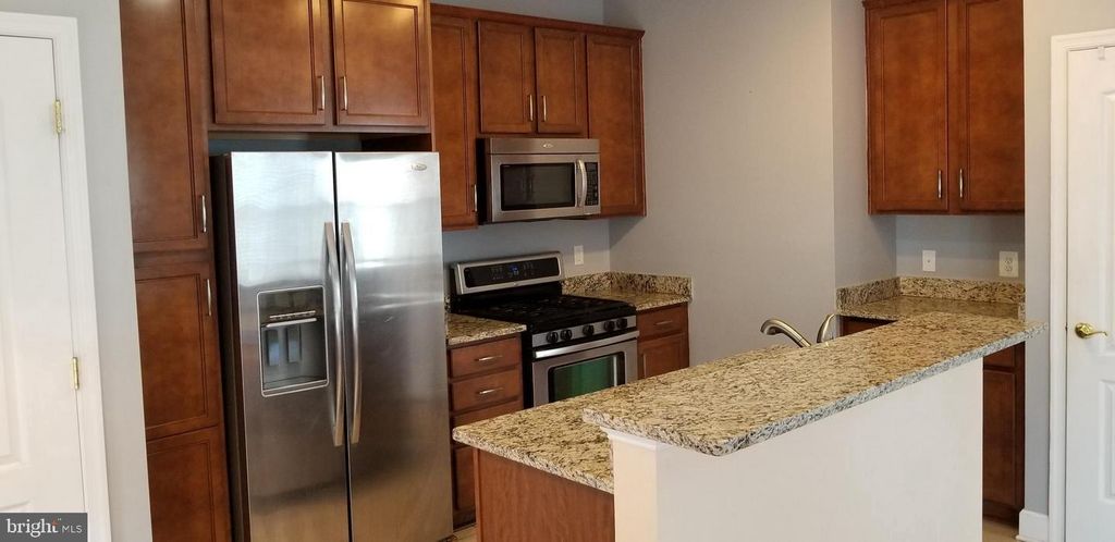 Photo of 13595 Station Street, GERMANTOWN, MD 20874 (MLS # MDMC2203272)