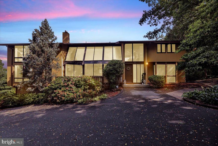 Welcome to 125 Grandview Boulevard — a rare, custom-built contemporary home set on over an acre in the prestigious Wyomissing School District.
As you arrive, you’ll be greeted by a private driveway with space for up to 10 vehicles, plus a detached two-car garage and an additional attached one-car garage.
Step inside to find exposed beams and expansive windows that fill the home with natural light. The open-concept layout creates a bright, airy atmosphere, perfect for both everyday living and entertaining. The spacious kitchen features granite countertops and a large pantry, making it as functional as it is stylish.
A stunning double-sided stone fireplace adds warmth, while the sunken living room—complete with its own fireplace—offers a cozy, inviting space to relax. The main floor also includes a sunroom, ideal for soaking in peaceful views throughout the day.
Upstairs, the expansive primary suite features multiple closets, a private balcony with overlooking views, and a dedicated dressing room — a unique touch. All four bedrooms offer generous space and ample storage.
The finished basement adds even more living and entertaining space, with a second fireplace and another cozy sunken seating area. From here, step outside to your private backyard oasis, featuring a 7-foot in-ground pool, an in-ground hot tub, and a gazebo — perfect for warm summer days or quiet evenings. As a bonus, the home features a geothermal system to help significantly offset utility costs — an energy-efficient upgrade that adds lasting value and comfort.
This one-of-a-kind property blends custom craftsmanship, and refined tranquility — all in a highly desirable location. Bring your vision and make this extraordinary home your own.