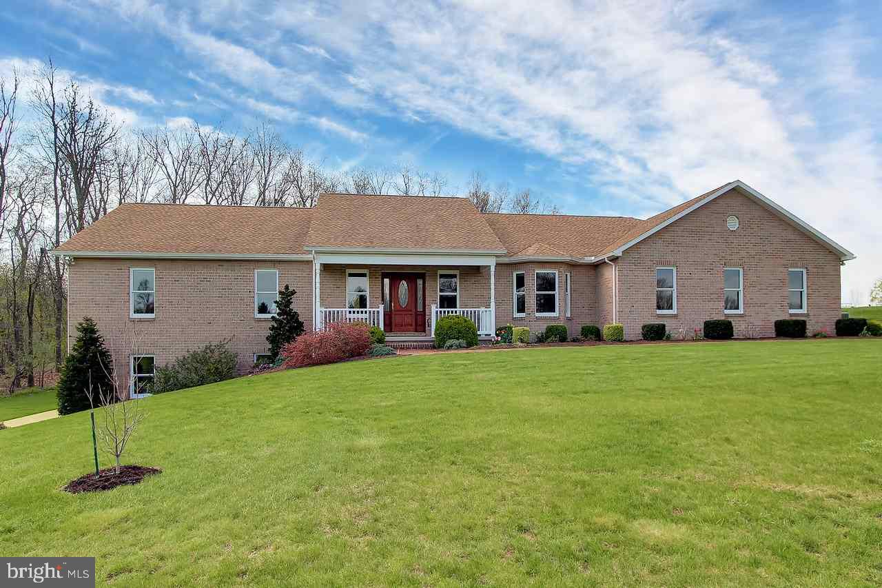 Low Taxes - Clean and Green - Beautiful all brick ranch with 4 car garage on 13.7 acres - Custom built - Many upgrades. Granite stone accents and bay windows in kitchen.Energy efficient/solar generates enough electric that excess is sold. Great location.