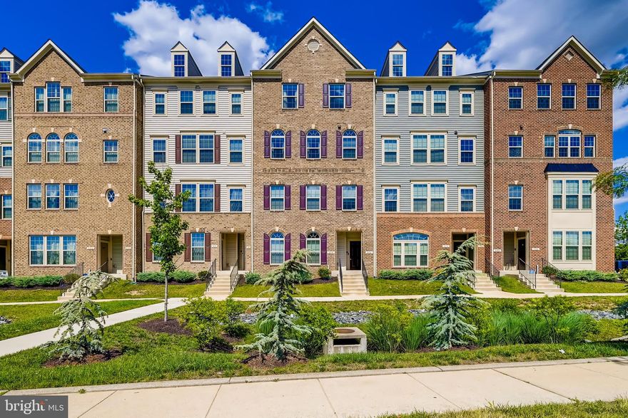 This incredible Odenton townhome condo boasts 3 bedrooms, 2 full and 1 half baths, and a 1-car garage! Built in 2018, this gorgeous new construction home has been further updated throughout. You'll fall in love with the sophisticated finishing touches! Step inside to experience the stunning ambiance for yourself. The open-concept kitchen, living room, and dining room are beaming with natural light. The main level features a powder room, laminate flooring, sleek white and grey cabinets, granite countertops, a large island, and stainless steel appliances. The kitchen leads to a balcony, the perfect place to enjoy your morning coffee or nightcap. On the upper level, you'll find three bedrooms and two full baths. You'll love the stunning primary bedroom,  complete with tray ceilings, a custom brick accent wall, and a spacious walk-in closet. The primary bath features a walk-in shower with glass doors and two separate vanities, while the hall bath boasts a tub/shower combination. There's nothing to do but move in!