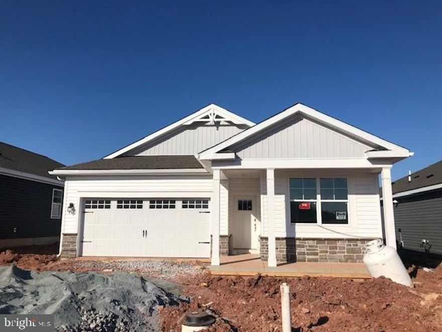 Merrit with front porch and backs to open space!  Interior boast white cabinets and white quartz countertops. * The Merrit by D.R. Horton is a stunning new construction, ranch home plan featuring 1,813 square feet of living space, 3 bedrooms, 1 study/flex room, 2 bathrooms and a 2-car garage. Look no further than the Merrit for the convenience of first floor living. The foyer welcomes you in past a large bedroom and flex room, you decide how this space functions! The kitchen with a large island perfect for prep work, entertaining and casual dining flows effortlessly into the living room and dining area. The owner’s suite is off the main living area and features a spacious bathroom and walk-in closet. A covered patio comes included and is the perfect outdoor space to enjoy. This home includes D.R. Horton's Home is Connected® package, an industry leading suite of smart home products that keeps homeowners connected with the people and place they value the most. The technology allows homeowners to monitor and control their home from the couch or across the globe.