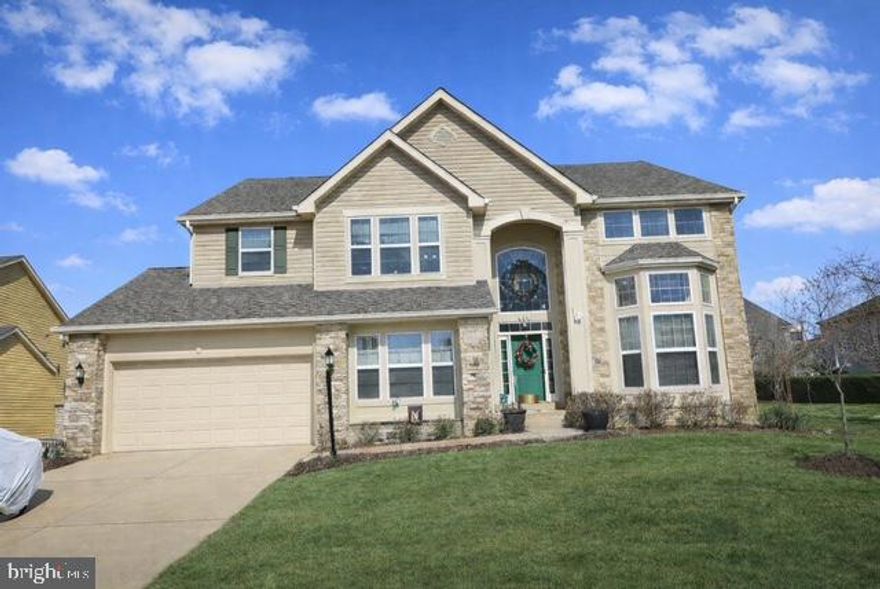 Elegant Transitional Colonial with Two-Story Foyer | Original Owners

Tucked within a quiet Columbia cul-de-sac, this beautifully maintained Contemporary Colonial blends timeless architecture with modern upgrades designed for today’s lifestyle. Thoughtfully crafted with dual staircases and exceptional flow, the home offers refined entertaining spaces alongside comfortable everyday living.  The main level welcomes you with a spacious eat-in kitchen featuring gas cooking and seamless access to a real wood deck—perfect for indoor-outdoor gatherings. The family room is anchored by a warm gas fireplace, while formal living and dining rooms are enhanced by Hunter Douglas window treatments, adding both elegance and functionality. A large private office, main-level bedroom, and full bath provide flexibility for guests, multigenerational living, or remote work. Fresh paint, new door hardware, and upgraded lighting create a bright, move-in-ready atmosphere.  Upstairs, Golden Oak hardwood flooring extends across the entire bedroom level and continues into the finished main level, creating visual continuity rarely found in homes of this size. All bedrooms feature generous closet space, while the owner’s suite offers a custom walk-in closet and spa-inspired bath with jetted soaking tub and an extraordinary five-showerhead hydrotherapy shower.  The walk-up lower level transforms entertainment into an experience, featuring a fully equipped gym where a Smith machine, weights, and Life Fitness treadmill convey, along with a dedicated movie theatre complete with built-in surround sound speakers and a professionally designed three-tiered seating layout. A kitchenette, full bath, Hunter Douglas vertical blinds on sliding doors, and expansive storage complete the space.  The roof, approximately 10 years old, includes a Platinum Protection Roofing System Limited Warranty transferable to the next owner.  Modern conveniences include:  Dedicated Movie theatre/Media Room,  Level 2 (240V) EV charger, two-zone HVAC systems, two water heaters, MyQ smart garage technology, insulated garage door & upgraded LiftMaster opener, ProPaint Systems Evolution garage floor with lifetime guarantee.  Located moments from Columbia’s trails, parks, shopping, dining, tennis, pickleball, swimming pools, golf courses and major commuter routes, this home offers privacy, comfort, and elevated living in one of Howard County’s most desirable communities.