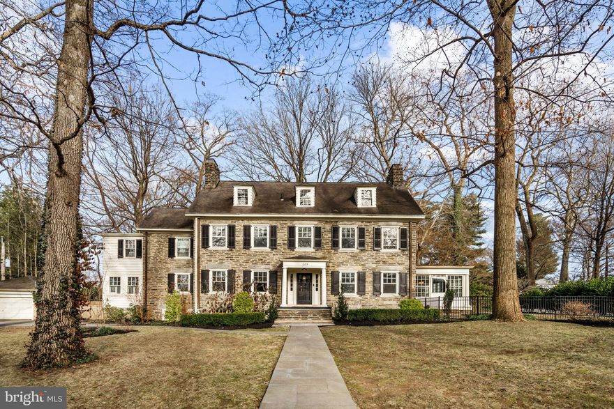 Nestled conveniently close to Merion station, this stone colonial home offers a harmonious blend of timeless charm and modern convenience. Its corner position ensures ample natural light, highlighting the warmth of the hardwood floors found throughout.

Step inside and you're greeted by a welcoming foyer, featuring a classic staircase as its focal point. To the right, a comfortable living room with a fireplace provides a cozy spot to unwind, seamlessly flowing into a sunlit solarium boasting walls of windows and access to the fenced yard.

On the opposite side of the foyer, a tastefully appointed dining room sets the stage for family meals and gatherings, connected to a well-equipped kitchen complete with wood cabinetry, stone countertops, and a relaxed family TV area.

Upstairs, the primary suite offers a tranquil escape with a generous walk-in closet and marble bath, accompanied by three additional bedrooms and another full bath, ensuring plenty of space for family or guests. Ascend the back staircase to discover more bedrooms and baths, offering flexibility and privacy.

Throughout the home, thoughtful design choices create an inviting and functional environment, making it the perfect place to call home.