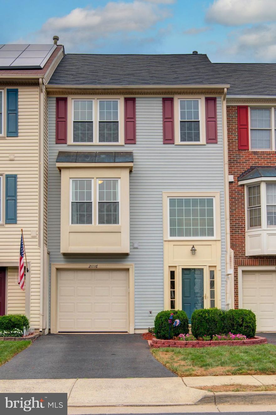 Hurry...Price Reduction! Well maintained Garage Townhome in popular Ashburn Farm! Spacious & Open main living area with vaulted foyer & HW stairs and HW floors.  Freshly painted throughout most of the property! Large eat-in kitchen boasts a Gas Range, Pantry  and updated SS Appliances. Sliding glass doors lead to the wood deck overlooking the treed common area. The upper level is complete with a spacious primary suite, new carpet, dual closets, ceiling fan and primary bathroom ensuite with upgraded tile shower, tile floor and freshly painted.  New LVP flooring and light fixture in hall bathroom, Secondary bedrooms: new carpet and ceiling fans. The lower level has interior garage access, with a garage door opener, half bathroom and spacious recreation room with a cozy wood burning fireplace. The walk out back yard access adds convenience and functionality. Ease of Parking: Garage, driveway and a reserved spot out front - #3. 
UPDATES:  Water Heater 2025, Windows and lower level sliding glass door 2023,  Insulated Garage Door, Keypad and Remote 2024.  Ashburn Farm is a vibrant community and as a resident you'll have access to exclusive neighborhood amenities including 3 outdoor swimming pools, tennis/pickleball courts, playgrounds, ball fields, basketball courts, scenic walking trails, tranquil ponds & fountains, community parks, playgrounds, a clubhouse, Pavillion, picnic area, sand volleyball and more! Enjoy nearby shopping, dining and the public library.  Ashburn Park (a.k.a. Dinosaur Park) features picnic and playground areas. Trailside Park has a playground, in-line hockey rink and lighted baseball/softball fields. Convenient access to the Ashburn Metro Silver Line, W&OD Trail, One Loudoun, the Dulles Greenway and other commuting corridors and nearby Dulles International Airport. Zoned for top-rated Stone Bridge High School and top tier feeder schools.  In an unbeatable location, and endless possibilities, this home is ready to welcome you. Welcome Home!