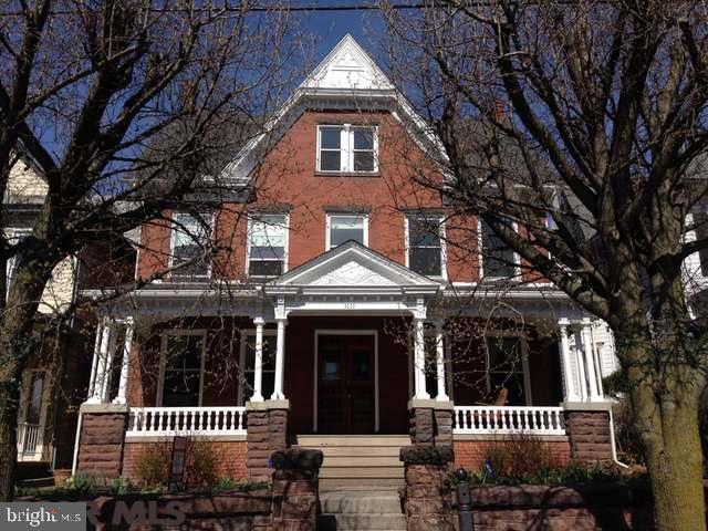Welcome to this freshly painted elegant 3 story all brick home situated in the heart of historic Tyrone. This truly one of a kind property features hardwood floors throughout, arched doorways, custom built ins, crown molding, original pocket doors along with a gentleman and ladies parlor (each with their own fireplace). From the stately front porch to the new craftsman style kitchen, this could be the home of your dreams. The third floor (walk up attic) offers an additional 1000 sq ft. with rec/playroom and plenty of storage. Don't miss this wonderful opportunity to own a piece of history in the Borough of Tyrone. A 1 year HSA Buyers Warranty Included!