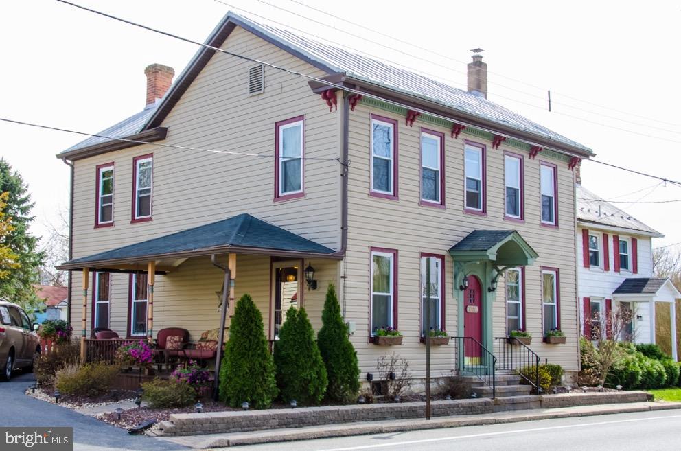Welcome Home to the "Joseph Fahrenbaugh house". This adorable home is move in ready! Enjoy conveniences & updates of renovated kitchen, newer windows, CA, WIC, 2nd flr laundry, 2 full bath while still keeping the beauty of time w/ original woodwork, doors, fixtures & beautiful pine wood flrs. Enjoy the landscaped areas in front while relaxing on front porch or fenced in back yard on your patio. Lg storage shed. CV schools