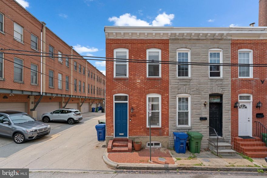 Charming 2-bedroom townhome in the heart of Federal Hill! This well-maintained end unit blends historic character with thoughtful updates — all tucked away on a quiet street. The bright, two tone eat-in kitchen features stainless steel appliances, including a gas stove and microwave rangehood. Adjacent dining and family rooms boast original hardwood floors, exposed brick, and a warm, inviting atmosphere. A convenient half bath and laundry room complete the main level.

Upstairs, you'll find a full hall bathroom with a stylish double sink vanity, along with two nicely sized bedrooms offering ample closet space. One of the bedrooms opens directly to a private rear deck, perfect for morning coffee or evening relaxation. The roof was refinished approximately 3.5 years ago, offering added peace of mind.

You can't beat the location — you’re moments from popular restaurants, shops, parks, and the Inner Harbor and also have the convenience of a public parking lot located just around the corner. A perfect blend of character, comfort, and city living!