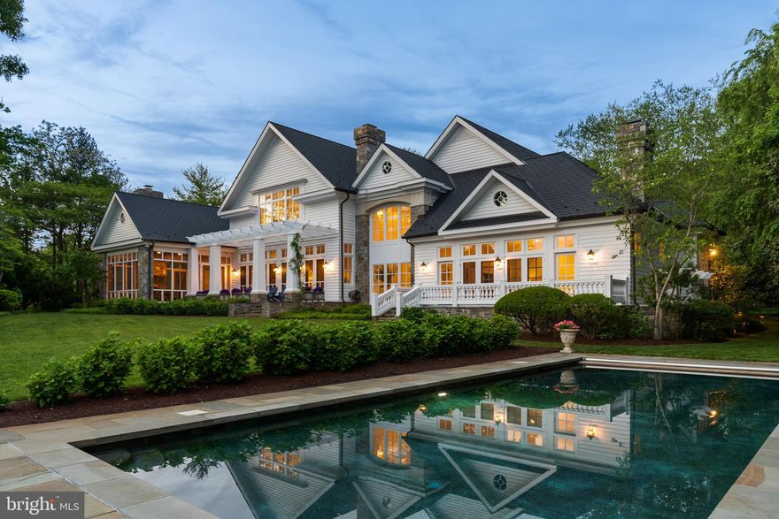 MELVIN ROAD WATERFRONT ESTATE! A winding, tree-canopied drive leads to Silver Maple Manor, a breathtaking waterfront and equestrian estate nestled on nearly eight acres along Little Aberdeen Creek. Designed by the renowned Scarlett Breeding and built with masterful craftsmanship, this European-inspired retreat feels as if it has stood for centuries, its mature landscaping and thoughtful details evoking the grandeur of a bygone era. With 5 bedrooms, 6 full baths and 2 half baths, this home is a masterpiece of custom millwork, rough-sawn oak flooring, and exquisite stonework. The grand foyer welcomes you with soaring 21-foot ceilings, a sweeping curved staircase with a brass handrail, and Venetian plaster walls that glow in the natural light. Every room is designed to embrace the water views, from the elegant living spaces to the chef’s kitchen, where marble countertops and a Thermador cooktop await culinary creations. The finished room above the garage offers a wonderful game room or retreat.  The home also features 2 offices and a bonus room with cedar closet that is perfect for a gym.  A temperature-controlled wine cellar offers a place to store prized vintages, while the butler’s pantry, complete with a Sub-Zero beverage cooler and Miele double ovens, ensures effortless entertaining. Beyond the home, the estate unfolds into a sanctuary of outdoor luxury. A heated saltwater pool, framed by bluestone pavers and a pergola-shaded terrace, invites both relaxation and celebration. The screened sunporch, with its stacked-stone fireplace and beadboard ceiling, provides a cozy retreat in every season, flowing seamlessly to the flagstone patio, where the water shimmers just beyond. For those drawn to the water, the estate offers four deep-water slips, two boat lifts, and a cedar boathouse, a work of art in itself with handcrafted shutters and masterful carpentry. Whether setting sail for an afternoon on the Chesapeake or simply watching the boats drift by, life here is tied to the rhythm of the water. Equestrians will find a barn thoughtfully designed for both function and beauty, with horse stalls, a conditioned tack room, a traditional hayloft, and its own dedicated driveway for trailers. The rolling pastures provide ample space for grazing, offering a picturesque setting for riding or simply enjoying the serene surroundings. Though it feels like a secluded retreat, Silver Maple Manor is just minutes from Historic Annapolis and an easy commute to Washington, D.C., Baltimore, and major airports. A home of rare beauty and distinction, it is a place where elegance, nature, and craftsmanship intertwine, creating a timeless estate. Welcome Home!