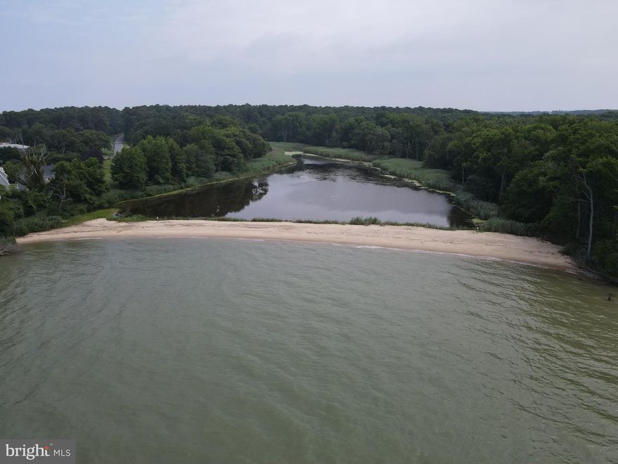 One of a kind waterfront property with private beach and pond. Home is a tear down. Do not enter without an appointment.