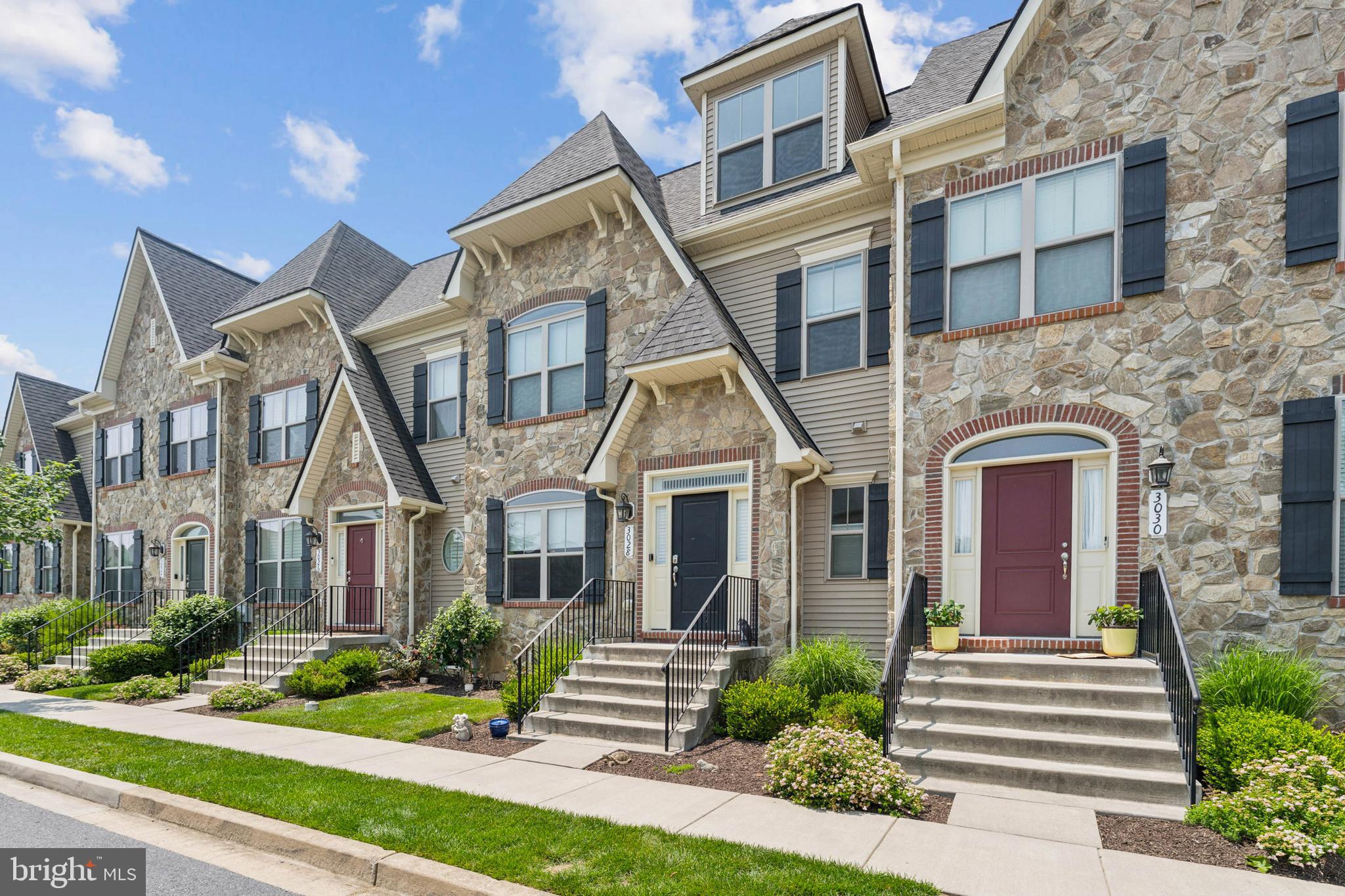 Over 4,000 square feet in this spectacular luxury townhouse in sought-after Worman's Mill! This home is the large Beauvais model with optional 4th floor!
Welcome to this beautifully upgraded luxury townhouse, built in 2018 and featuring the optional added loft for exceptional living space and versatility. This spacious home offers elegant finishes, thoughtful upgrades, and a layout designed for both comfort and entertaining.
Step inside to find gorgeous oak hardwood floors and an expansive open-concept main level enhanced by ceiling fans on every floor for year-round comfort. The entry and staircase feature upgraded iron balusters with a wooden handrail, adding a touch of modern elegance to the home's timeless design. The gourmet kitchen will impress with GE stainless steel appliances, granite countertops, a large center island with pendant lighting, soft-close cabinetry, a 5-burner gas cooktop, double wall ovens, and an abundance of storage—including a custom-built stylish coffee bar with locking fridge and additional cabinets.
Upstairs, enjoy an amazing primary suite featuring two vanities, a soaking tub, and an oversized spa-style shower with bench seating. Closets include custom organizers for maximum efficiency. This level also offers two additional generously sized bedrooms, a full bathroom with a tub and dual sinks, and a conveniently located laundry room with built-in cabinetry and a stylish sliding barn door. One more level up, a spacious loft provides the perfect flexible area for a home office, playroom, or additional lounge space.
The finished basement boasts a full bathroom, a large bonus room (currently used as a guest bedroom) with two ceiling fans, a spacious rec room with an egress window for natural light and safety, and lighted storage under the stairs. The storage room also includes a convenient wash sink and motion-activated lighting.
Tech-savvy upgrades include two-stage heating/cooling with dual thermostats, TV outlets positioned behind each TV for a clean, wire-free look, and recessed lighting throughout. Fresh paint throughout and nearly-new condition make this home truly move-in ready.
Enjoy the low-maintenance backyard with beautiful hardscaping, offering a private, peaceful retreat—no lawn care required! An external natural gas line makes outdoor grilling convenient, eliminating the need for propane tanks. A two-car detached garage offers easy private parking.
Located in the desirable Worman’s Mill community, you'll have access to resort-style amenities including a clubhouse, fitness center, pool, tennis and pickleball courts, basketball, and a walkable village center with shopping and dining (new village shops just steps away!). Easy access to Route 15 and close proximity to Wegmans, restaurants, and downtown Frederick make commuting and daily errands a breeze.
Don’t miss this opportunity to own this spacious, updated model in Worman’s Mill with unmatched space, style, and convenience!