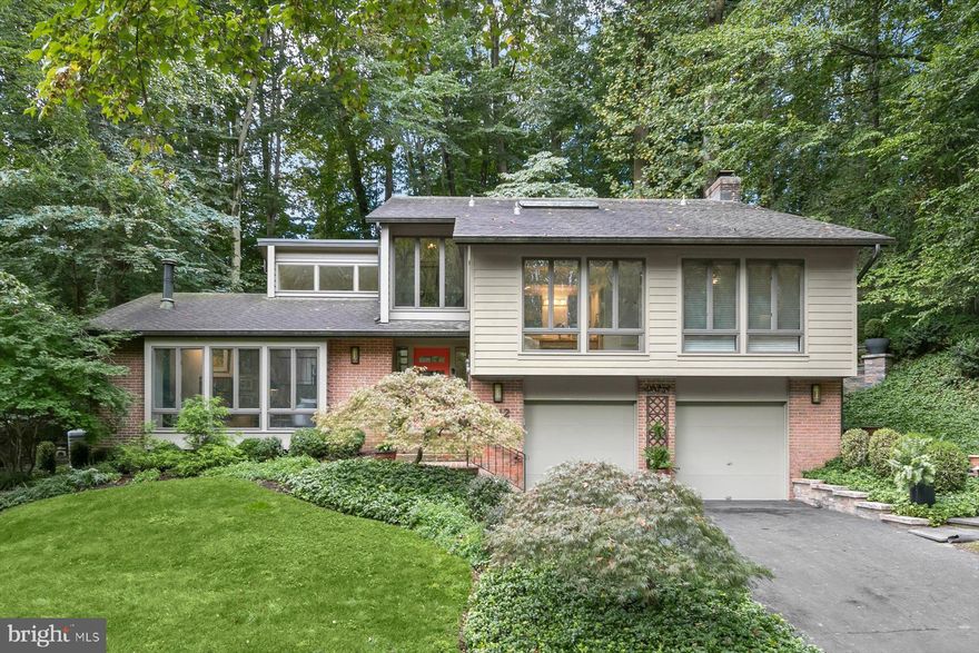 **All square footage and measurements are approximate and not guaranteed**

On the market for the first time. Beautifully maintained and thoughtfully modified by its original owner, this contemporary residence with a spacious addition is quietly situated in Congressional Country Club Estates, set apart from beltway noise yet close to all conveniences.

The welcoming floor plan flows easily for both comfortable living and entertaining. The elegant living room features cathedral ceilings and a wood stove creating a cozy and comfortable ambiance, while the modern kitchen offers Watkins cabinets along with a newer dishwasher (2022) and refrigerator (2023). A beautifully designed addition, filled with natural light and walls of windows, opens to a large patio that is perfect for outdoor gatherings and relaxation.

The expansive primary suite features a modern bathroom and a spacious walk-in closet. Upstairs, two additional bedrooms and a full bath (renovated in 2015), with one of the bedrooms offering access to a balcony, overlooking the serene setting. The lowest level include very spacious utility room  and storage room with newer washer and dryer (2023) plus convenient access to an over-sized two car garage. THE POTENTIAL 4TH BEDROOM IS NOW USED AS A DEN/PLAY AREA.

Other notable improvements include a 70 gallon gas water heater (2018), new roof and gutters (2019), extensive hardscape, outdoor terracing, added railings, gates, outdoor lighting, retaining walls, and patio installation (2017) by Four Seasons. Many Anderson windows and Anderson sliding doors were installed throughout.

This residence enjoys an ideal location with easy access to major commuter routes to D.C. and VA, downtown Bethesda, Potomac Village shopping, and the dining destinations along MacArthur Boulevard, Post Office, and the Coop. 

Don't miss this opportunity.