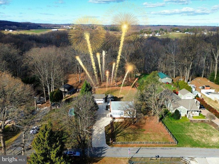 DISCOVER THE ULTIMATE PERRY HALL HIDEAWAY — A RARE COMBINATION OF PRIVACY, SPACE, AND MODERN COMFORT BACKING TO GUNPOWDER FALLS STATE PARK! If you’ve been searching for the one… THIS IS IT. Nestled on over an acre at the end of a quiet dead-end street, this MOVE-IN READY HOME delivers the lifestyle you've been dreaming of — with wooded views, no through traffic, and room to live, entertain, and grow.

Inside, you'll find 3 BEDROOMS and 2 FULL BATHS, including TWO INCREDIBLY SPACIOUS UPSTAIRS BEDROOMS and a VERSATILE LOWER-LEVEL SUITE with its own full bath AND PRIVATE ENTRANCE — PERFECT FOR MULTI-GENERATIONAL LIVING, EXTRA LIVING SPACE, PRIVATE OFFICE, OR GUEST RETREAT. Enjoy the warm glow of a WOOD-BURNING FIREPLACE, UPDATED APPLIANCES, and FRESH PAINT throughout.

Step outside to your own backyard sanctuary — featuring a FULLY FENCED YARD, REAR PATIO, COVERED FRONT PORCH, BONUS STORAGE SHED, and an OVERSIZED 2-CAR GARAGE with PARKING FOR 10+ VEHICLES. CENTRAL AIR INSTALLED IN 2025 adds year-round comfort and value.

All this, AT THE PERFECT PRICE, just MINUTES from HONEYGO REGIONAL PARK, WHITE MARSH MALL, LOCAL TRAILS, POPULAR DINING, and MAJOR COMMUTER ROUTES.

THIS ISN’T JUST A HOUSE — IT’S A CHANCE TO OWN A PIECE OF PEACEFUL, PRIVATE PERRY HALL LIVING. DON’T MISS IT!