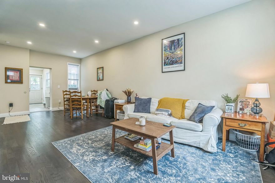 Come take a look at this updated home on a nice block in Port Richmond! Immediately your eyes will be drawn to the hardwood floors, iron railings and recessed lighting throughout the home.  The kitchen is equipped with tile flooring, stainless steel appliances, decorative back-splash, and granite counter tops.  On the second level you'll find two finished bedrooms and updated bath with custom tile.  The back yard is a good size for some private time.  The unfinished basement can be used as storage or converted to fit your needs.